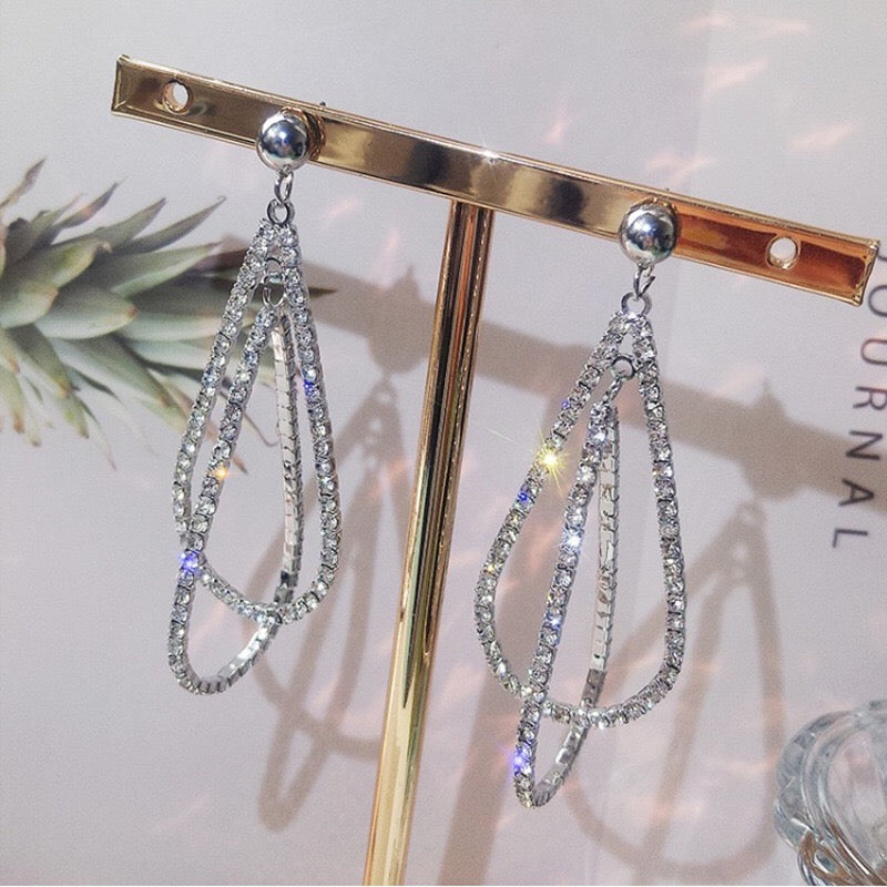 Elegant Multi Water Drop Earrings featuring alloy, rhinestone, and S925 silver, showcasing a cascading drop design.