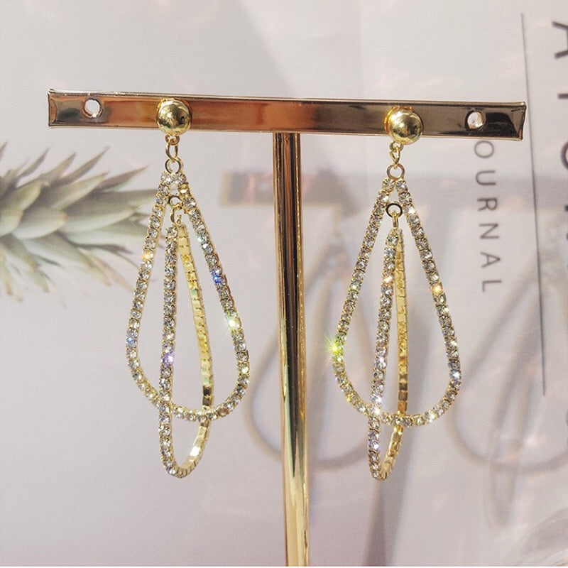 Elegant Multi Water Drop Earrings featuring alloy, rhinestone, and S925 silver, showcasing a cascading drop design.