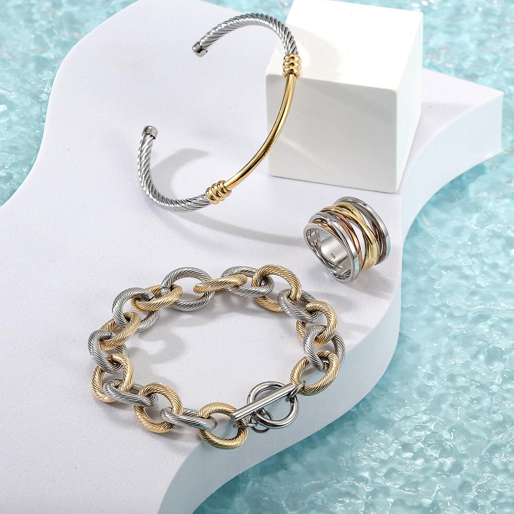 Multi-Color Cable Set featuring a chic bangle, bracelet, and ring in a two-tone cable design, elegantly displayed in a gift box.