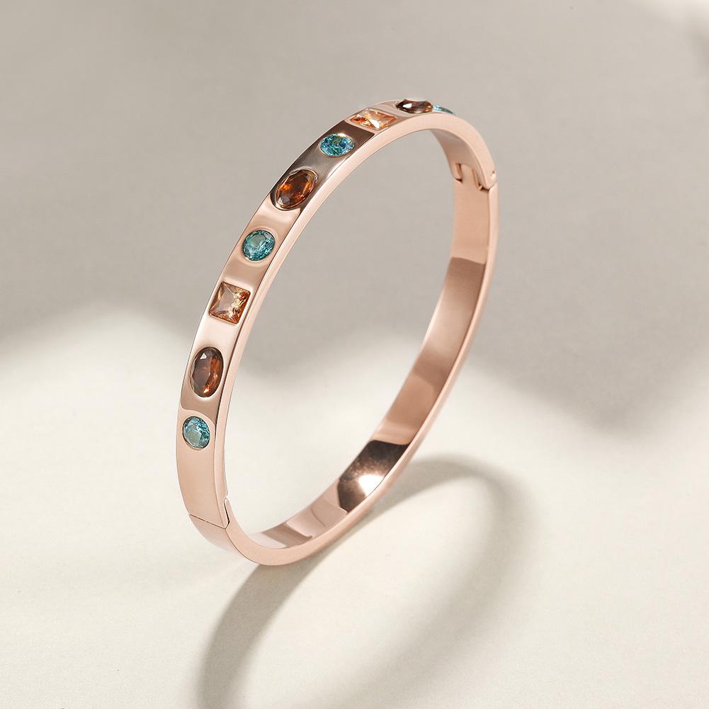 Elegant Multi-Stone Hinge Bangle made of surgical stainless steel with gold plating, featuring a stylish hinge design.