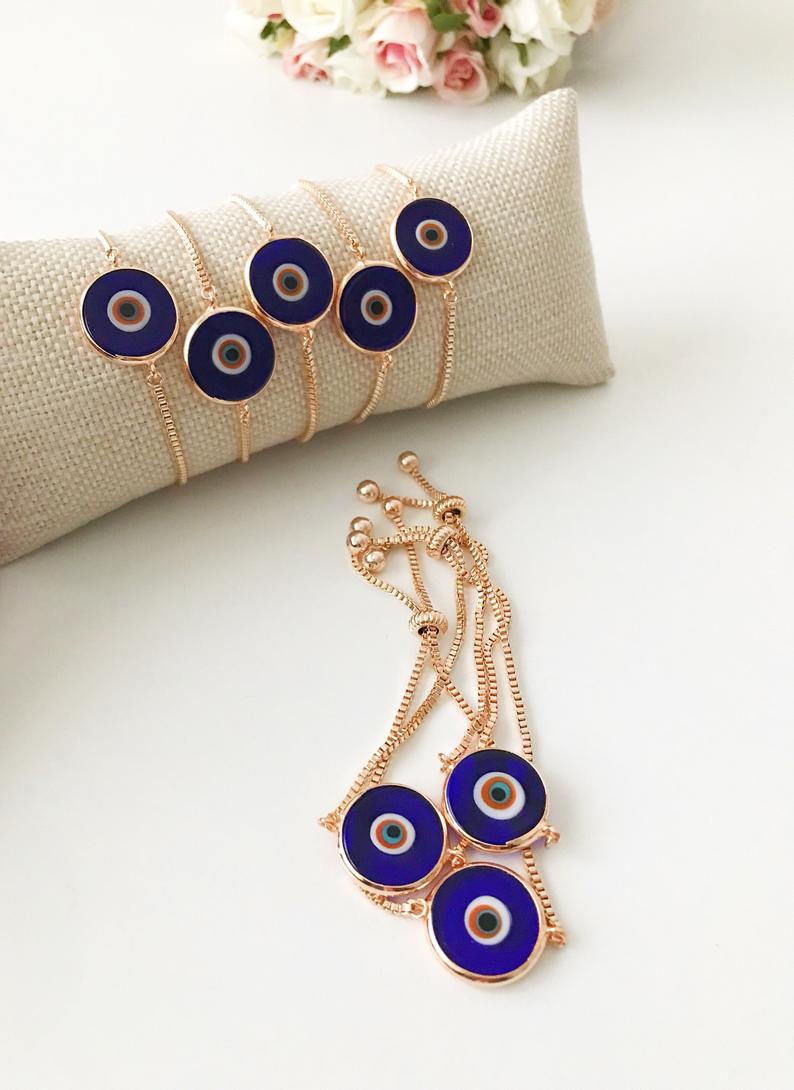 Murano Glass Evil Eye Bracelet featuring a blue glass bead on an adjustable rose gold stainless steel chain, symbolizing protection and style.