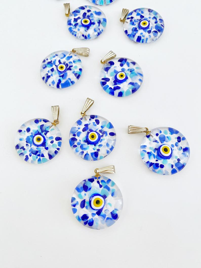 Handmade Murano Glass Evil Eye Pendant featuring a vibrant blue evil eye design, 22mm in diameter, showcasing intricate lampwork craftsmanship.