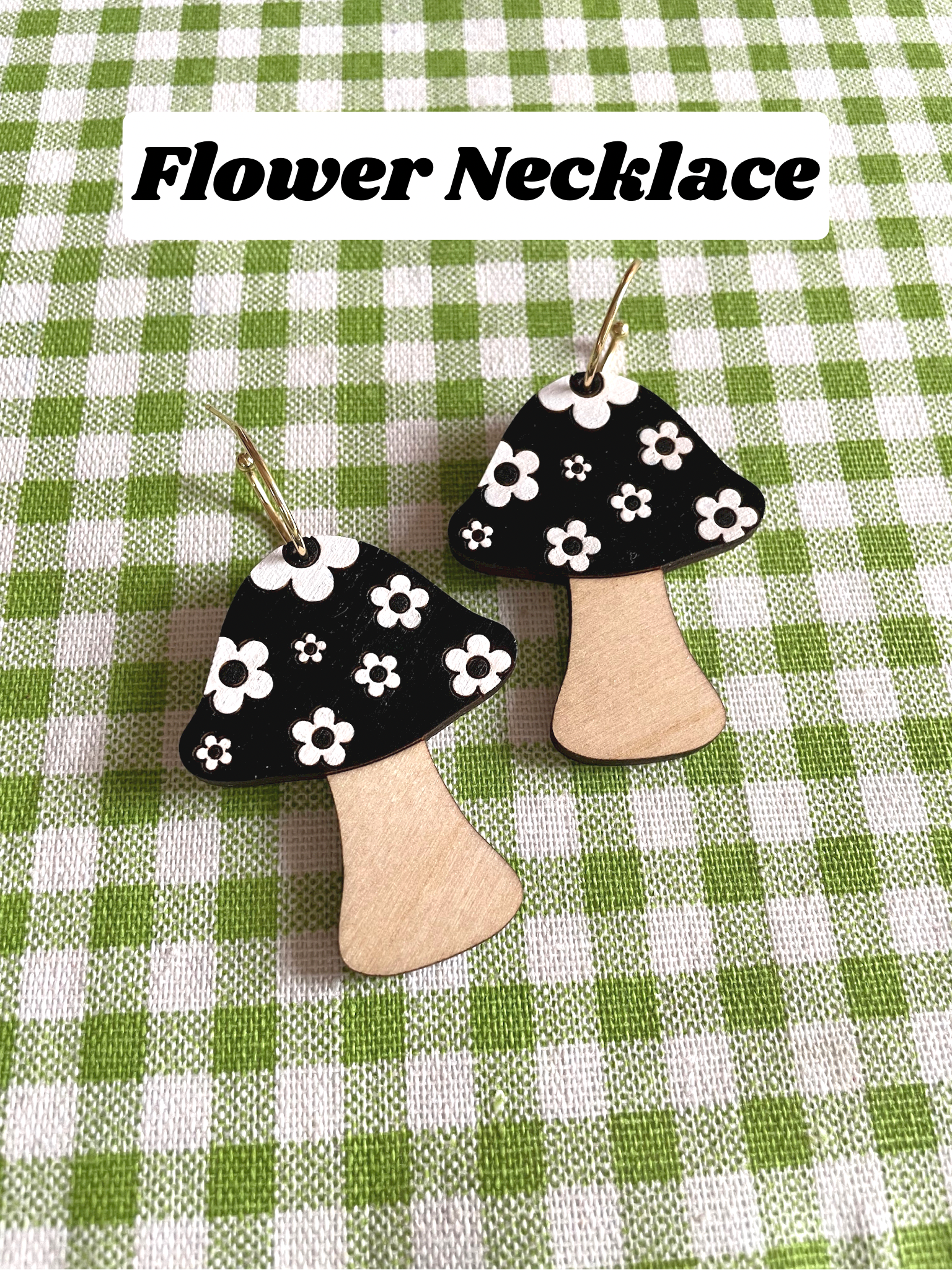 A beautifully crafted Mushroom Necklace featuring floral designs, made from sustainable Birch Plywood, showcasing intricate laser-cut details.