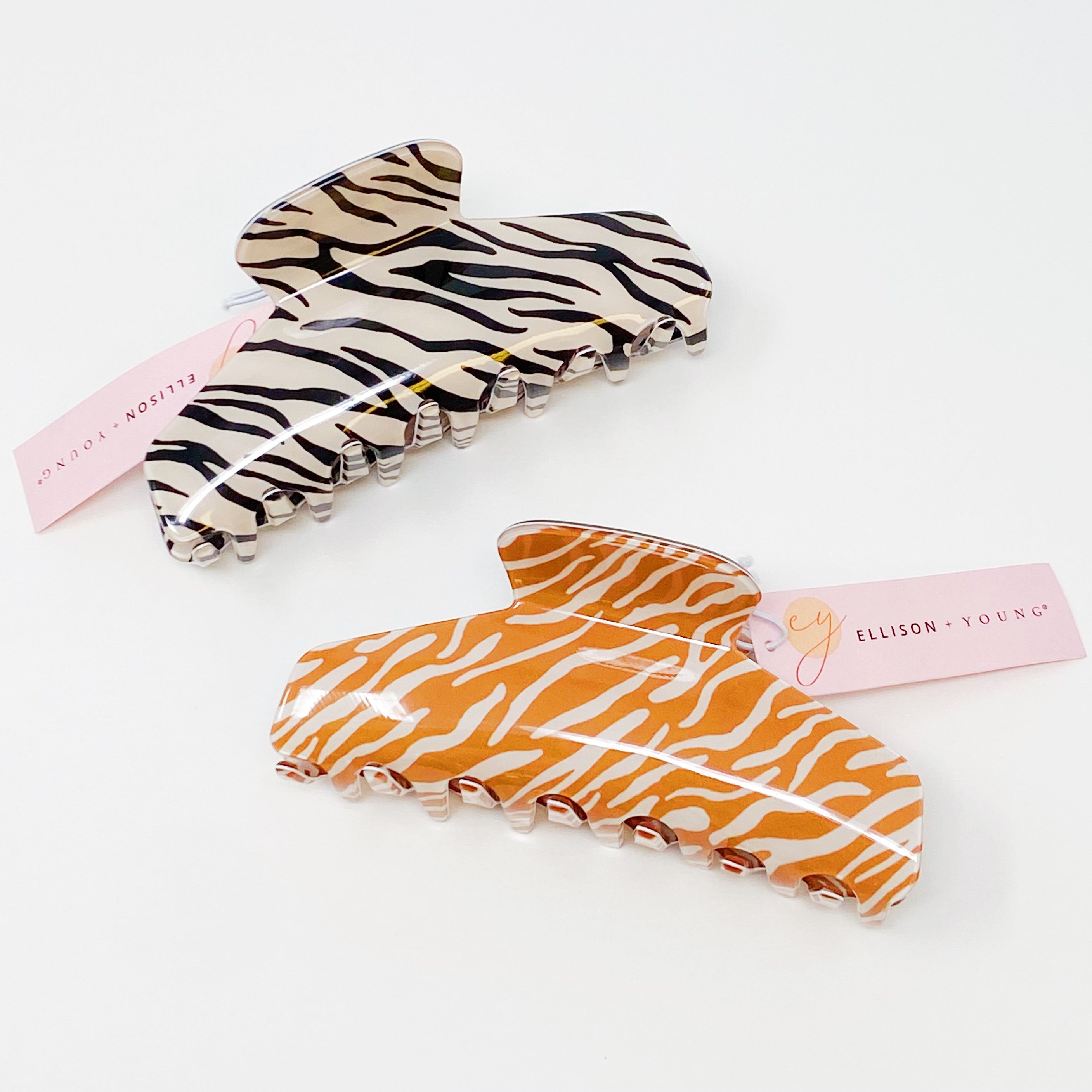 Muted zebra print hair claw clip made of durable acrylic, designed to hold thick hair securely with a stylish aesthetic.