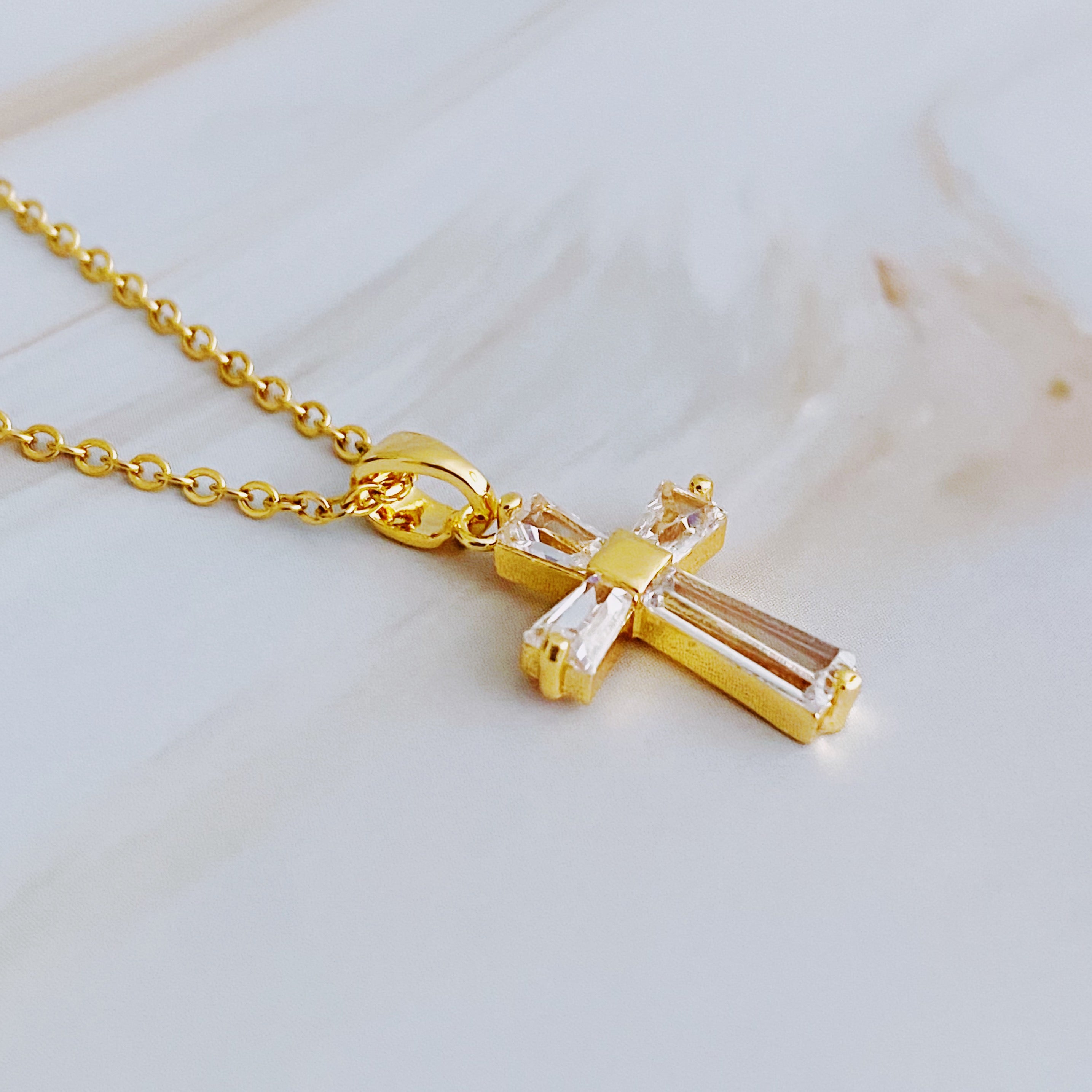 My Dear Crystal Cross Necklace featuring a clear crystal cross pendant on a delicate gold chain.