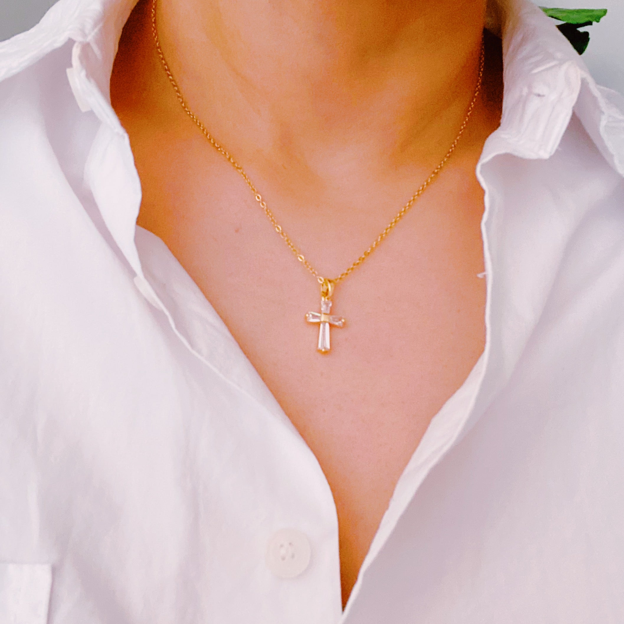 My Dear Crystal Cross Necklace featuring a clear crystal cross pendant on a delicate gold chain.