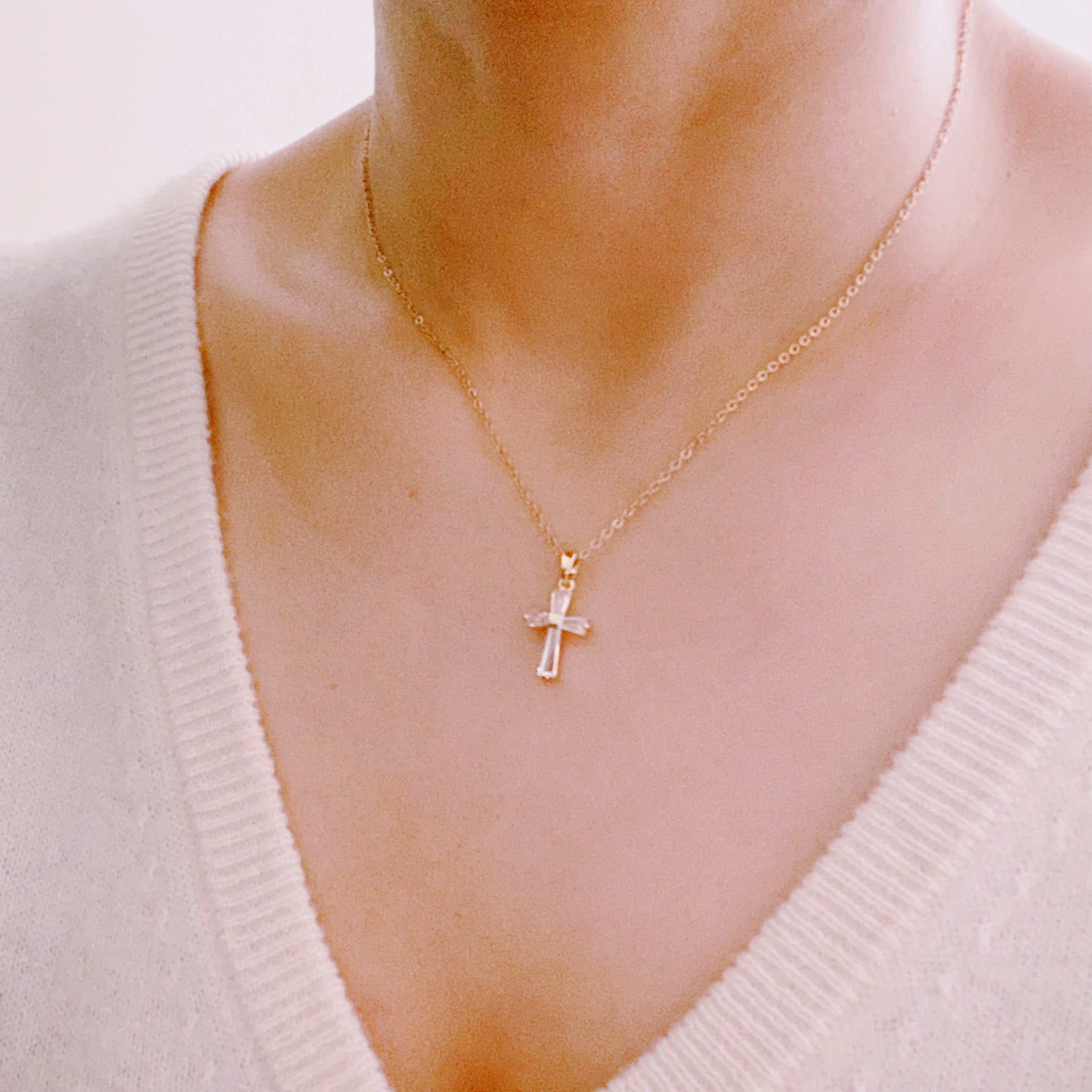 My Dear Crystal Cross Necklace featuring a clear crystal cross pendant on a delicate gold chain.