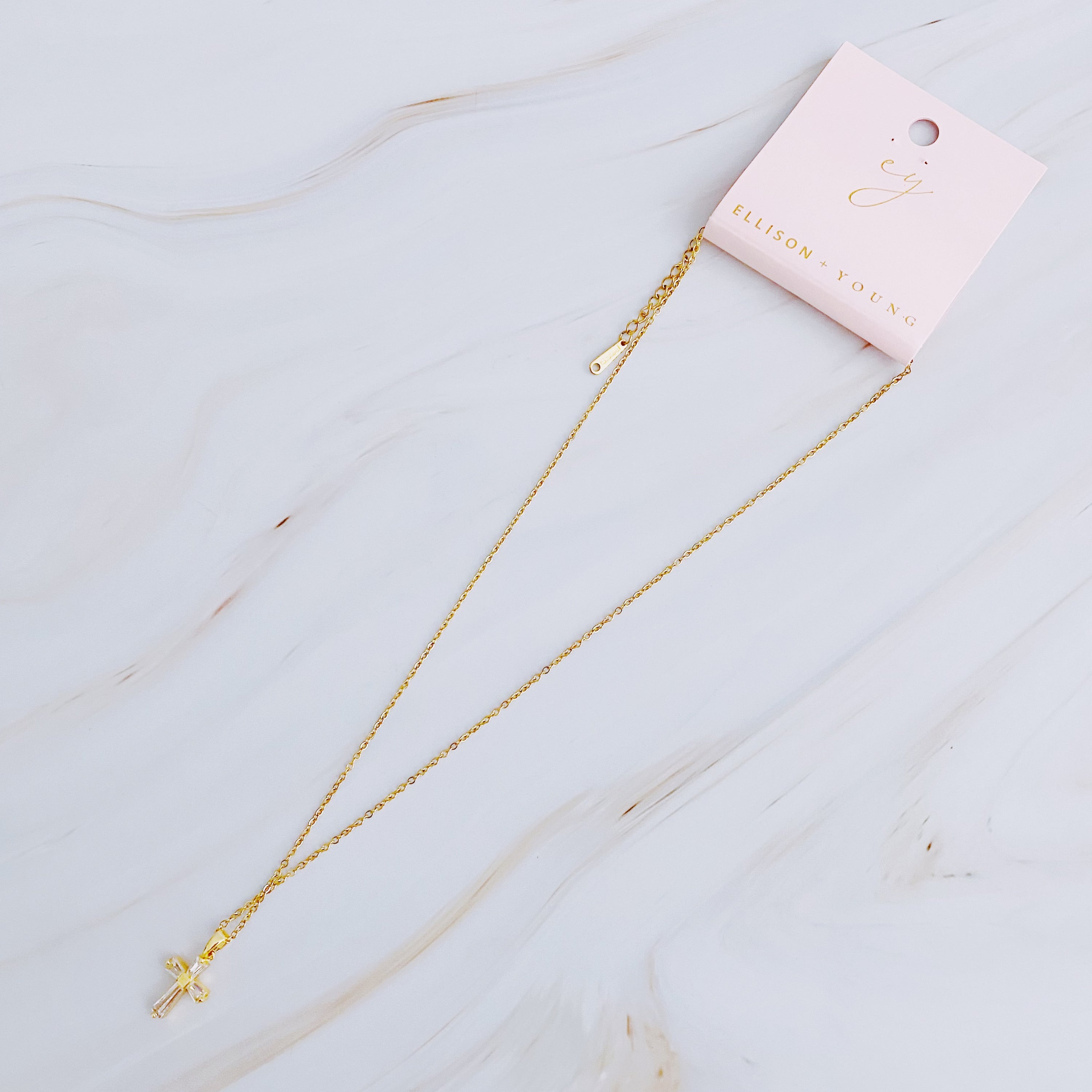 My Dear Crystal Cross Necklace featuring a clear crystal cross pendant on a delicate gold chain.