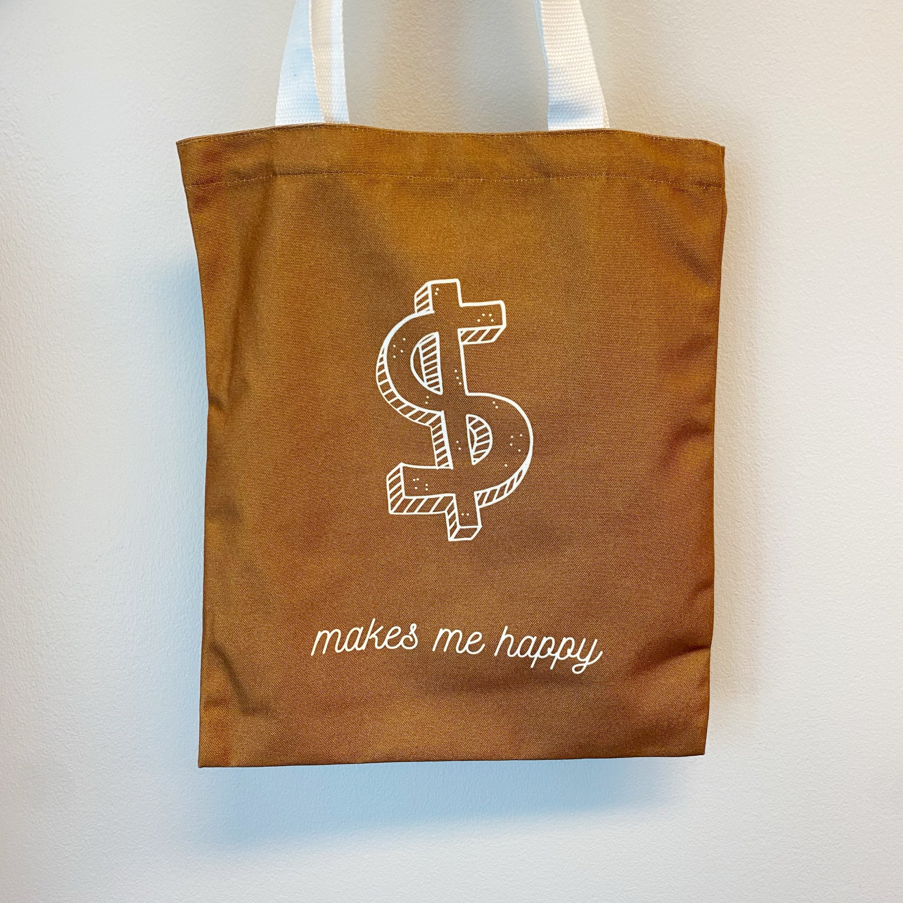 A stylish My Happy Canvas Tote featuring a positive graphic print, perfect for carrying books and small devices.