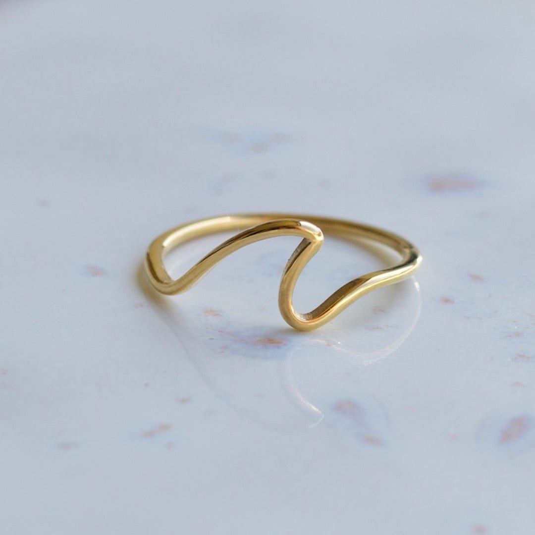 Mykonos Dainty Ocean Waved Line Stacking Ring in gold, showcasing its minimalist geometric design and cut-out wave line.