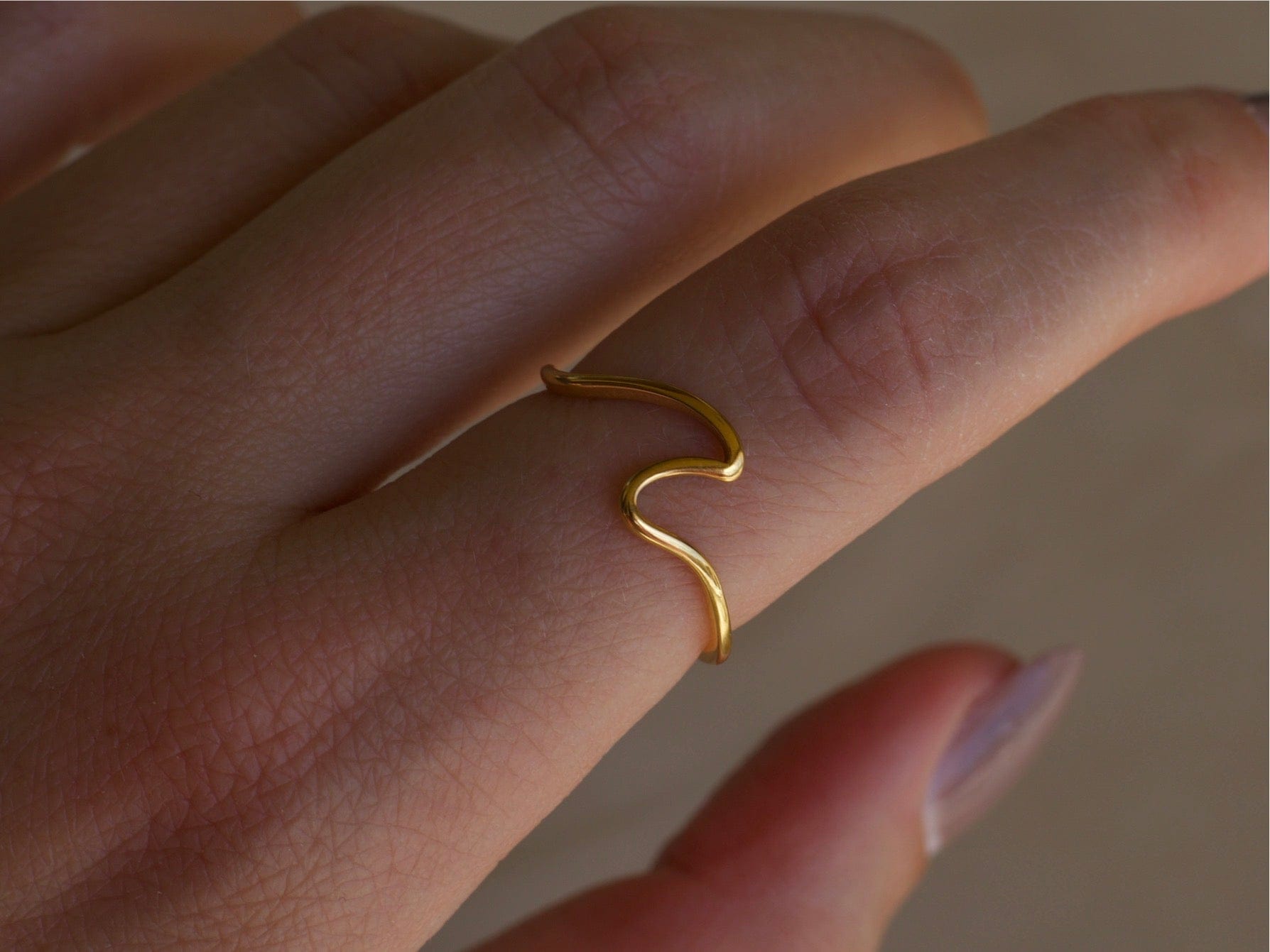 Mykonos Dainty Ocean Waved Line Stacking Ring in gold, showcasing its minimalist geometric design and cut-out wave line.