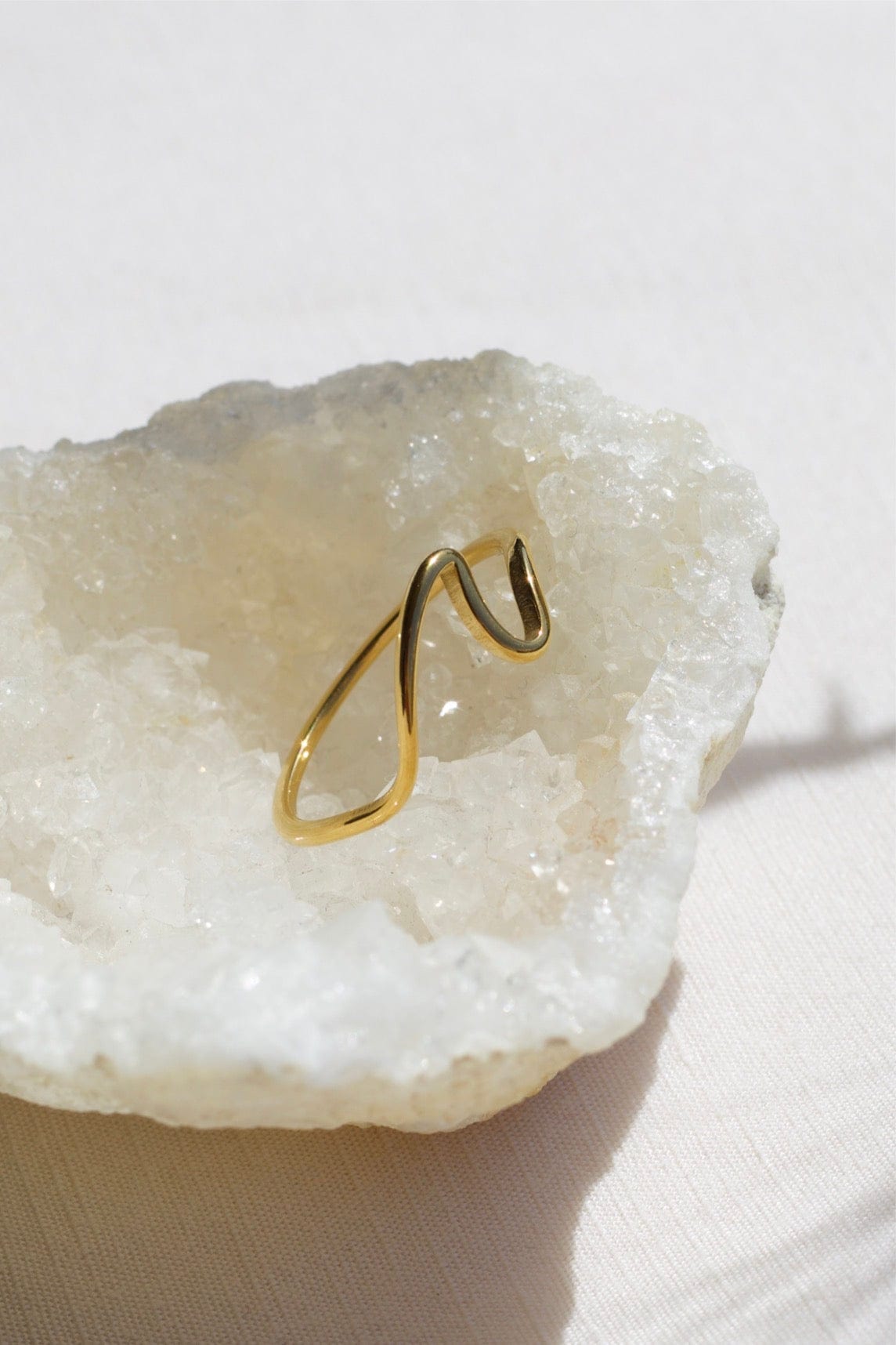 Mykonos Dainty Ocean Waved Line Stacking Ring in gold, showcasing its minimalist geometric design and cut-out wave line.