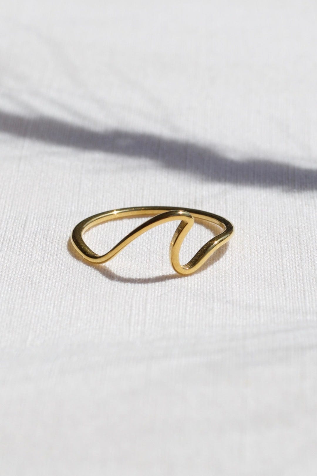 Mykonos Dainty Ocean Waved Line Stacking Ring in gold, showcasing its minimalist geometric design and cut-out wave line.