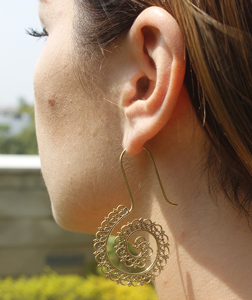 A pair of handmade Mystic Spiral Gold Earrings featuring intricate S-shaped designs, crafted from hypoallergenic materials.