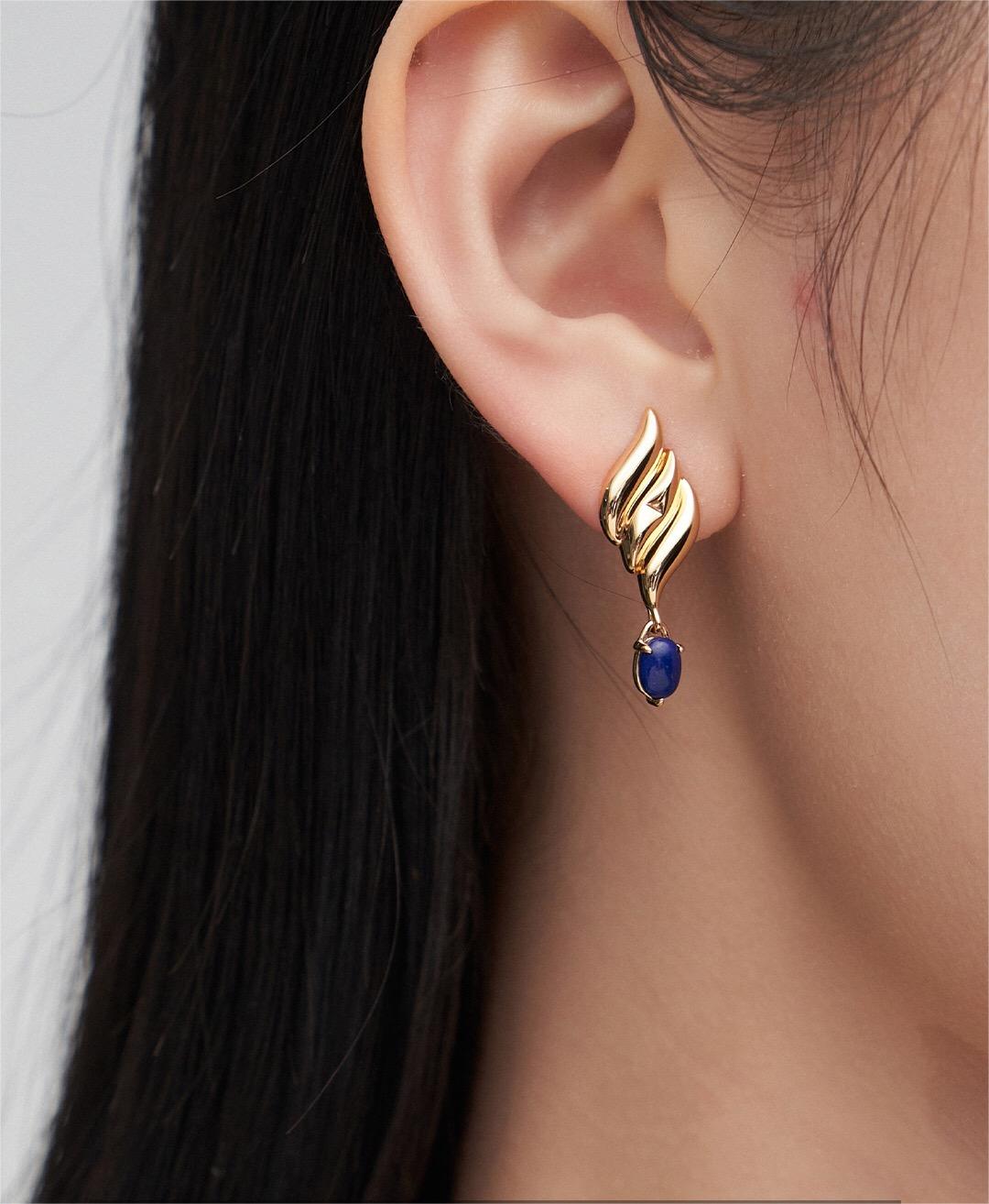 Handmade natural lapis lazuli asymmetrical earrings with gold vermeil, showcasing unique blue stones and elegant design.