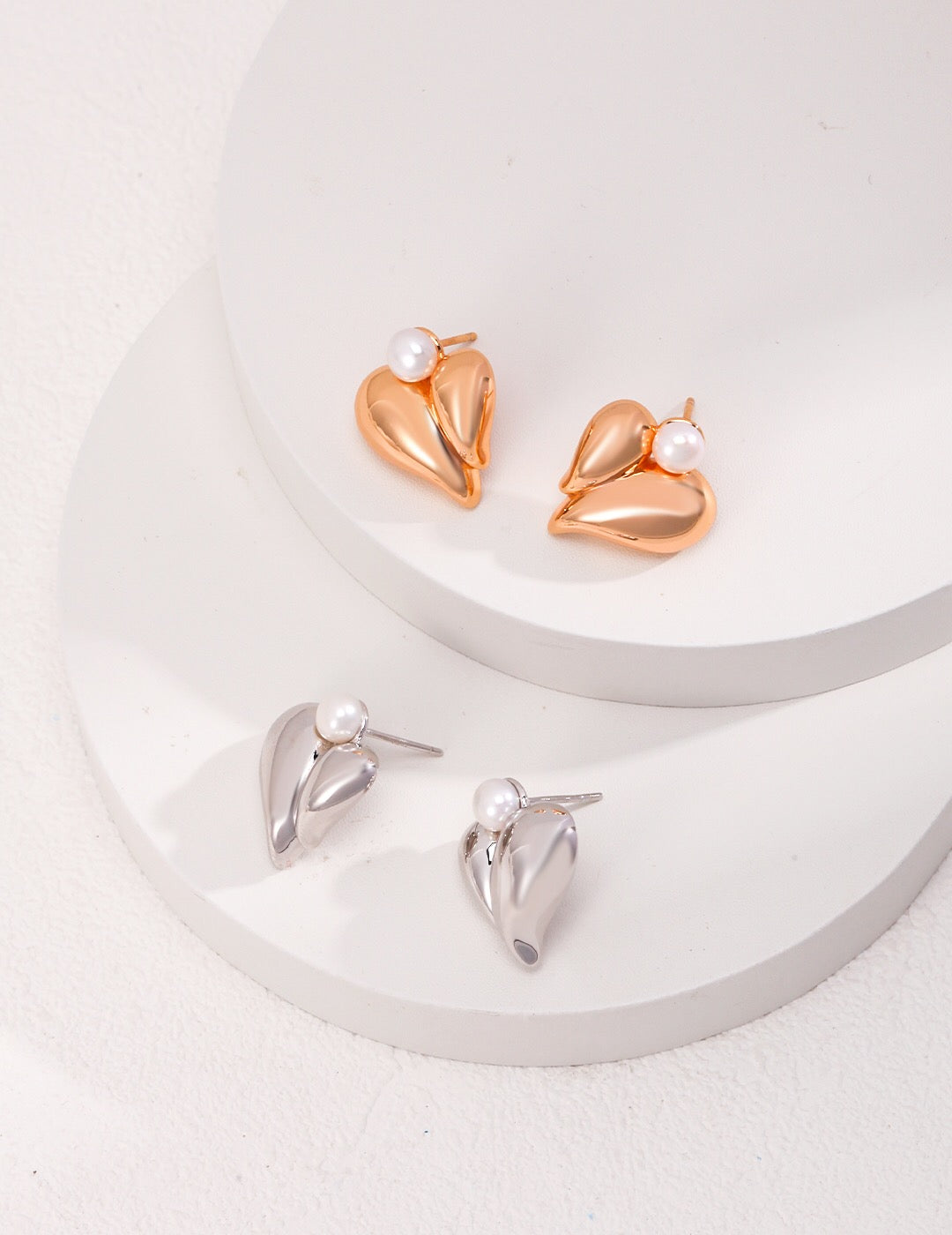 Natural Pearl Heart Stud earrings made of freshwater pearls and sterling silver, featuring a heart-shaped design.