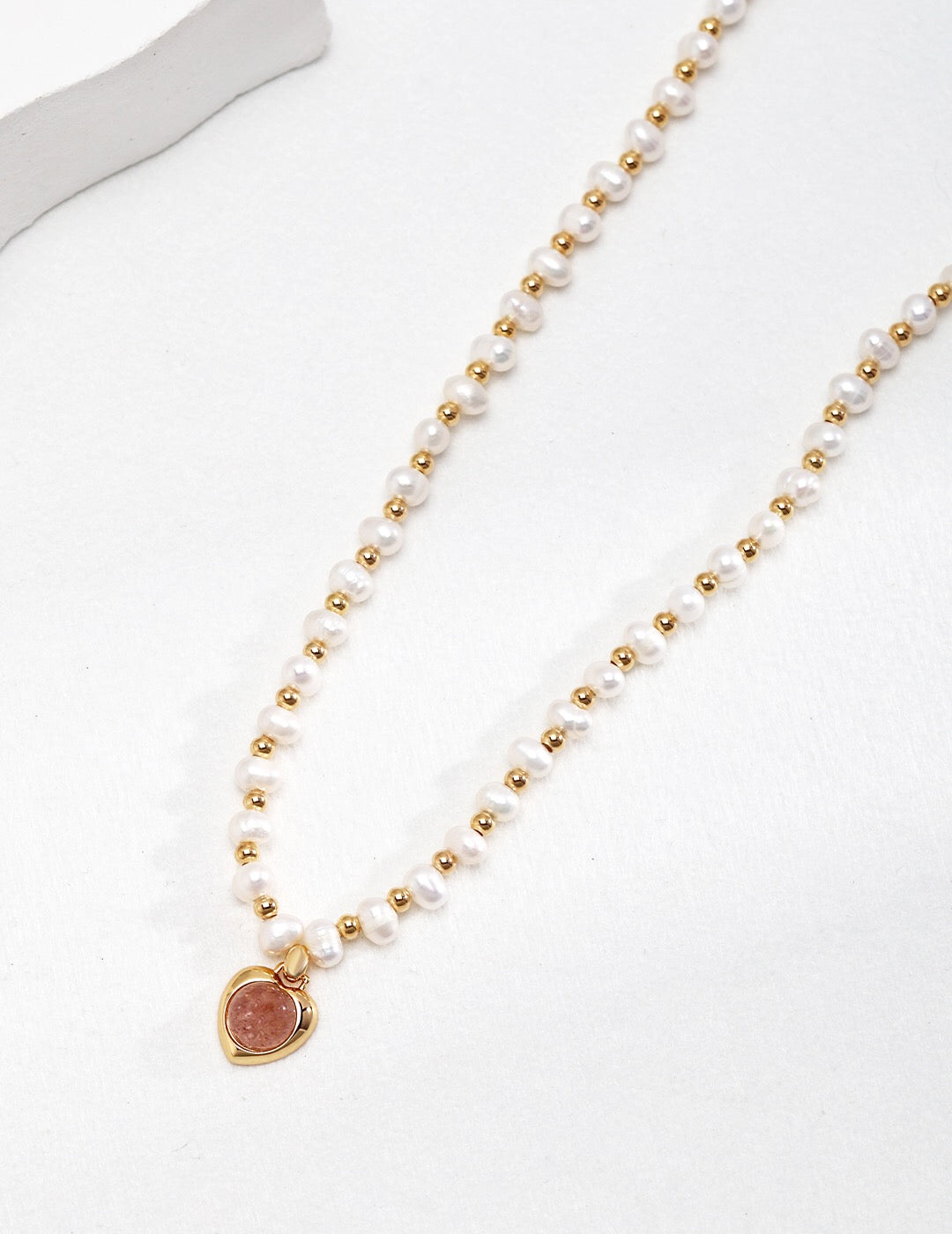 Natural Pink Strawberry Crystal Pearl Necklace featuring pink crystals and natural pearls with gold vermeil accents.