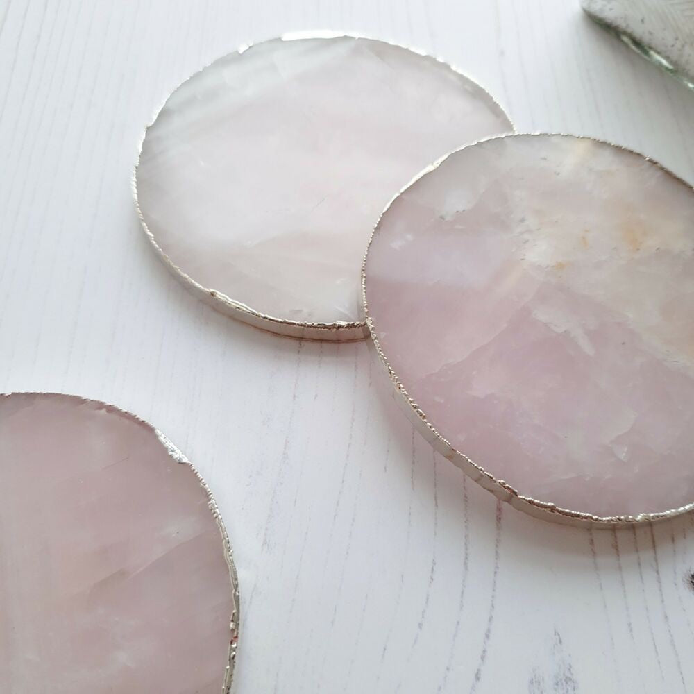 A set of Natural Quartz Drink Coasters showcasing unique patterns and colors, perfect for home decor and protecting surfaces.