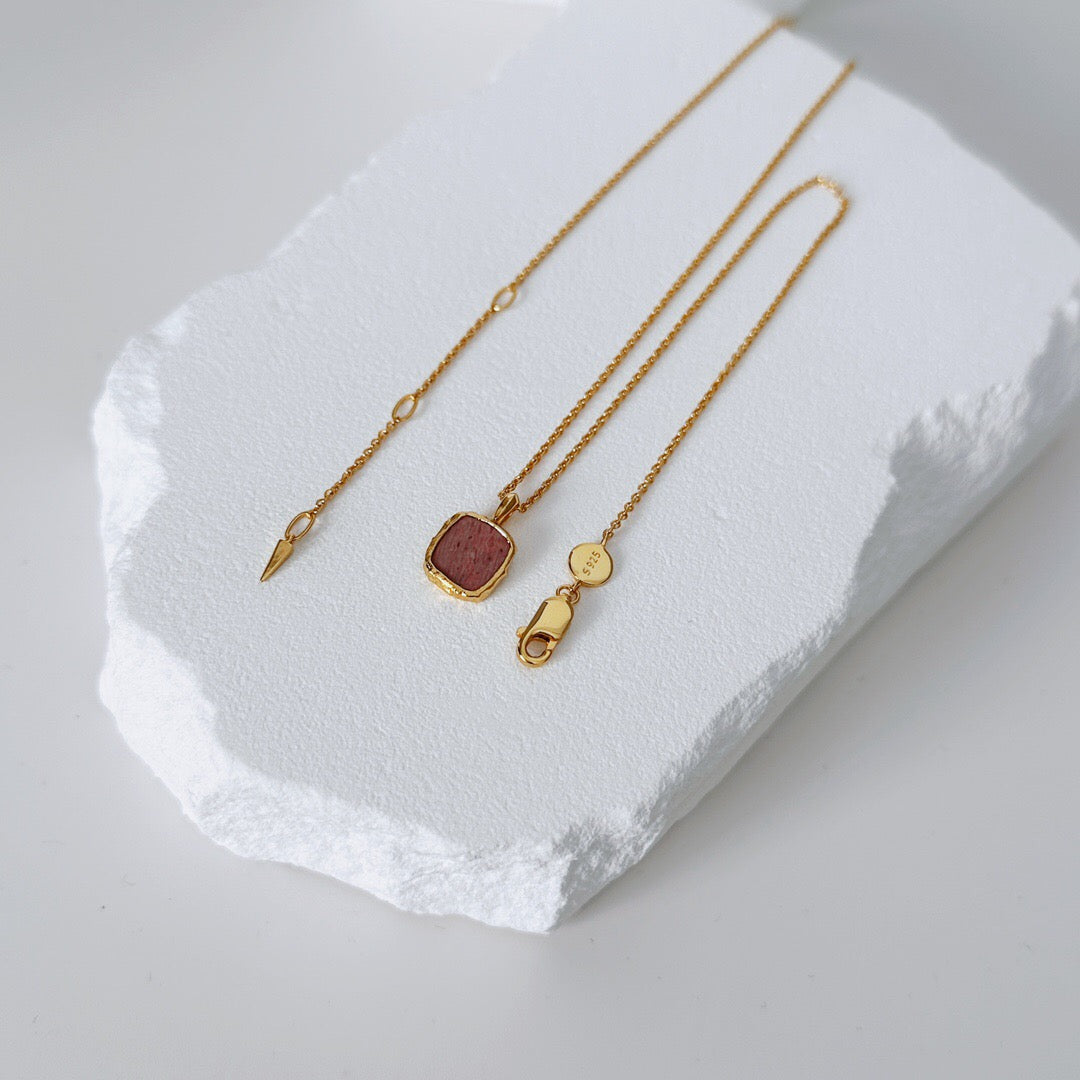 A handmade necklace featuring natural Rhodochrosite and Green Aventurine gemstones, accented with 18ct gold vermeil on sterling silver, showcasing its elegant design.