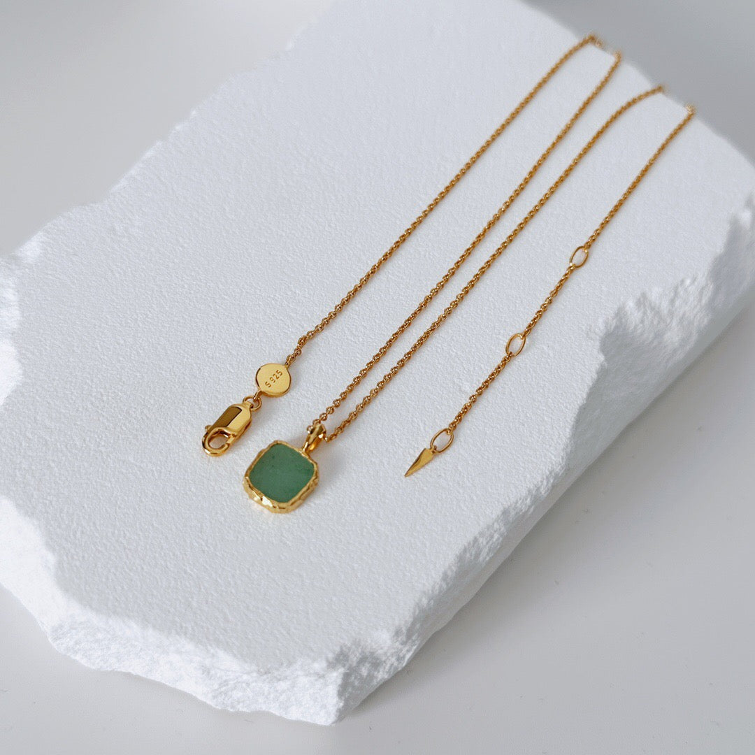 A handmade necklace featuring natural Rhodochrosite and Green Aventurine gemstones, accented with 18ct gold vermeil on sterling silver, showcasing its elegant design.