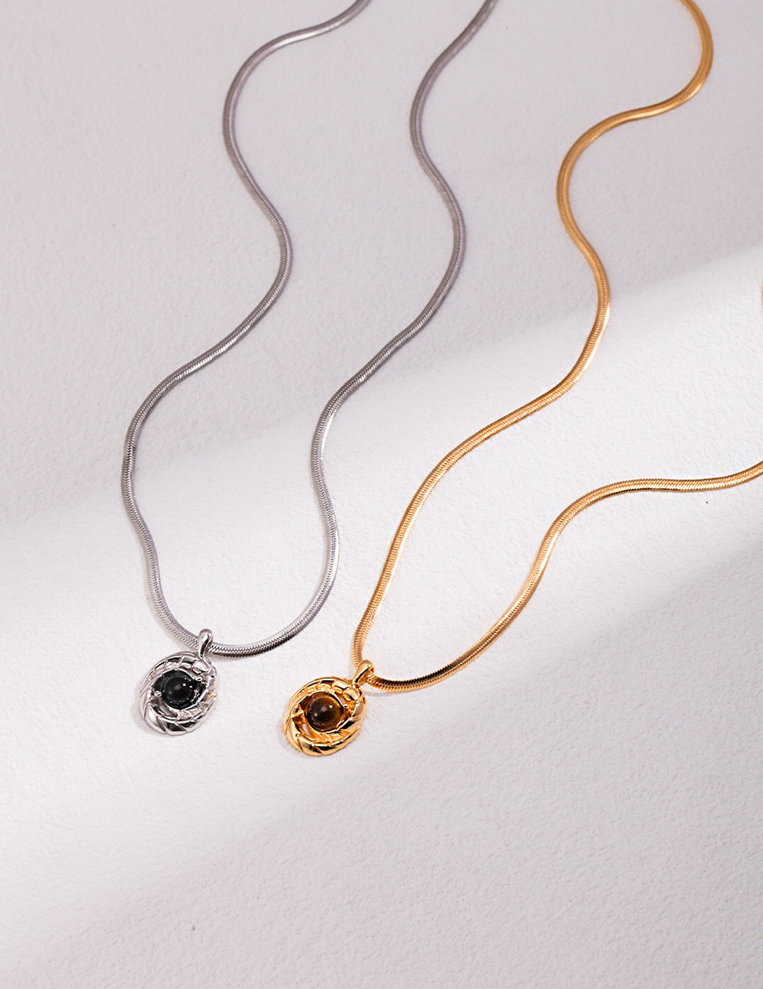 Natural Tiger Eye and Obsidian Pendant Bone Necklace featuring gold vermeil chain, showcasing the unique stones and craftsmanship.