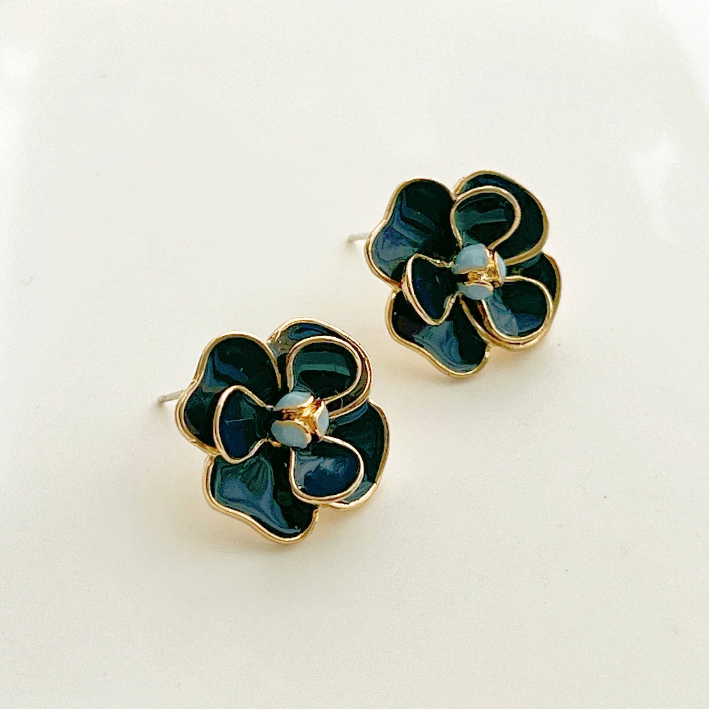 Navy blue rose earrings in flower shape, crafted from sterling silver and gold-plated bronze, displayed elegantly in a gift box.