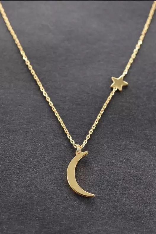 New Moon Necklace featuring a moon charm and side-hanging star on a 16-inch chain with extender.