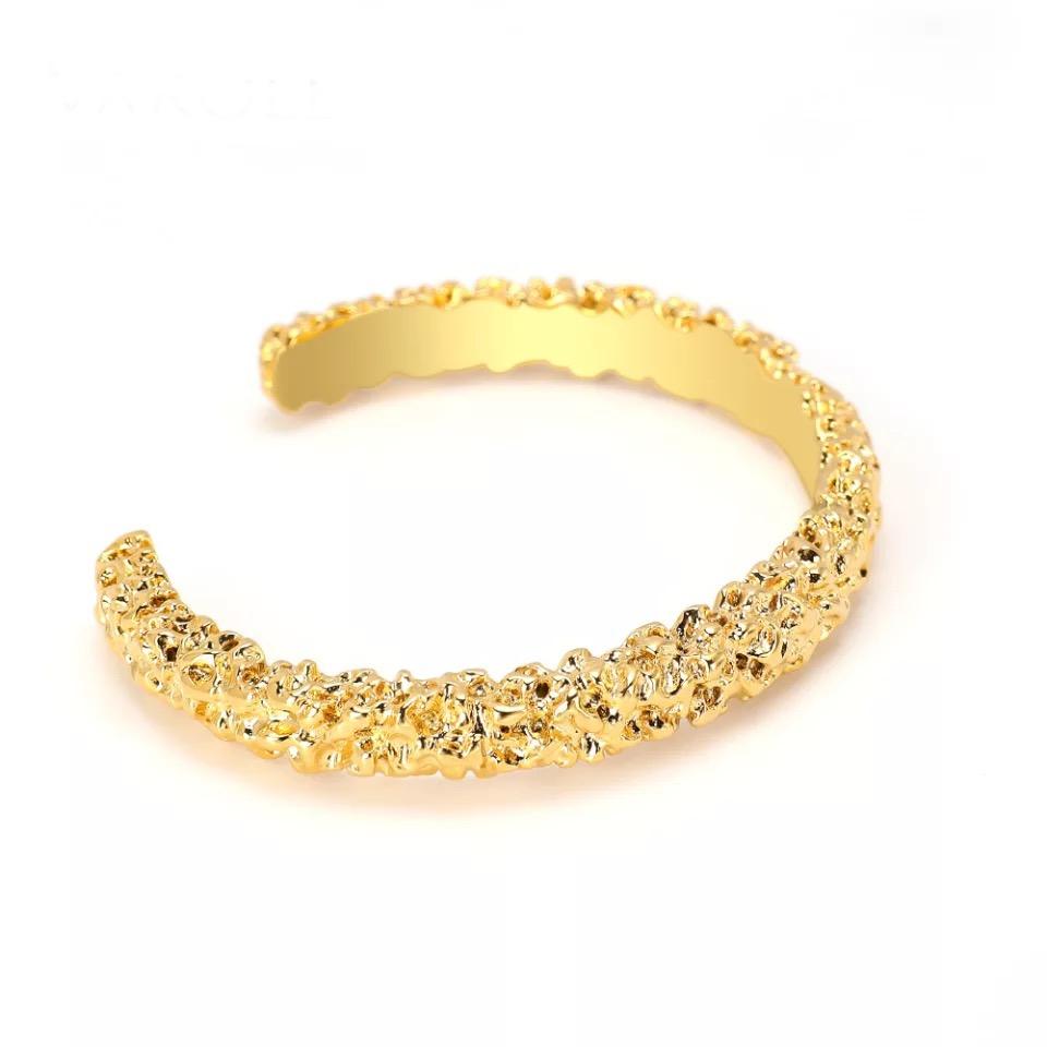 Nicole Cuff bracelet featuring a hammered design with 18k gold plating, showcasing elegance and style.