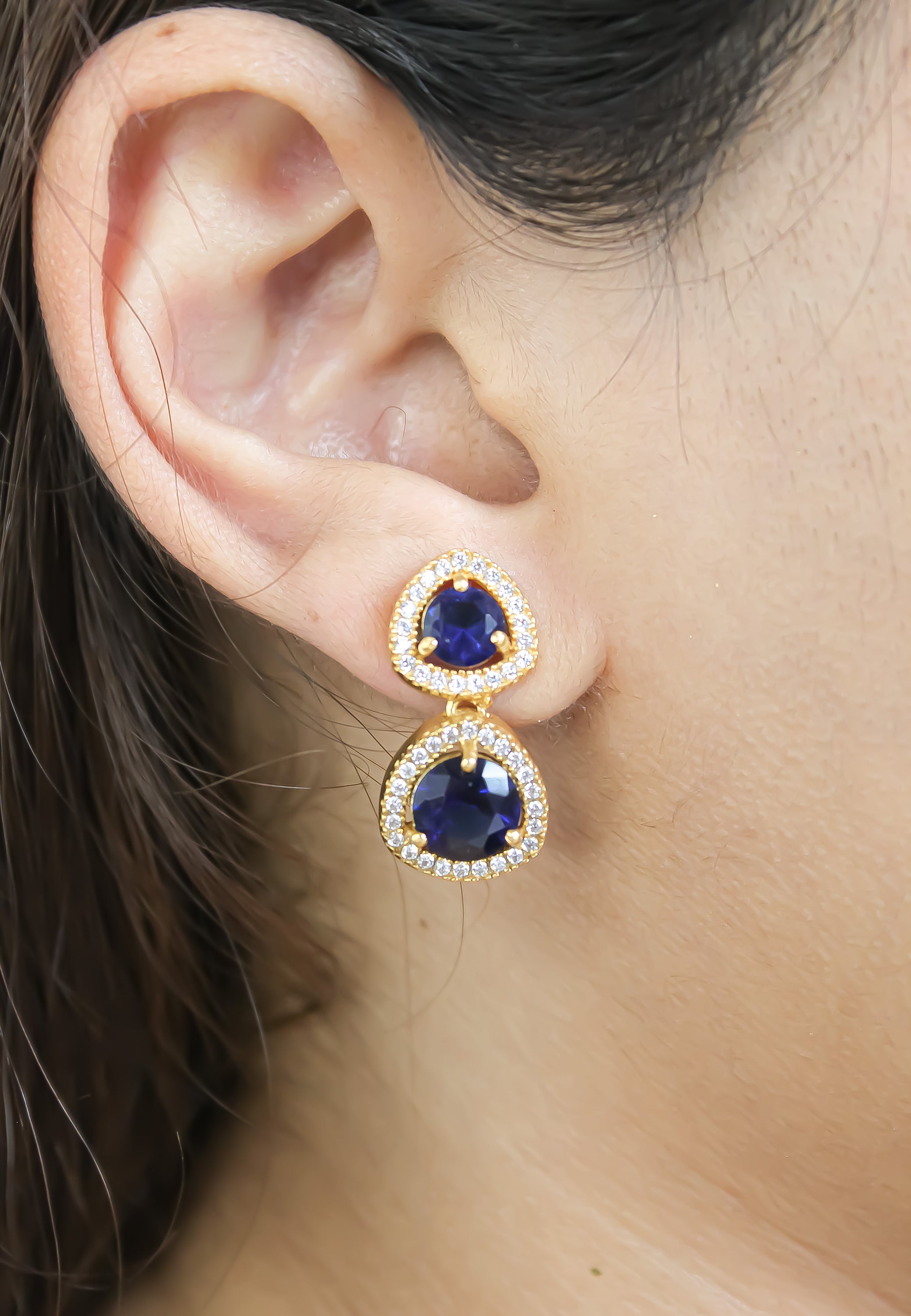 Elegant Nikobar Stone Earrings featuring gold plating and sparkling crystals, inspired by the Nikobar archipelago.