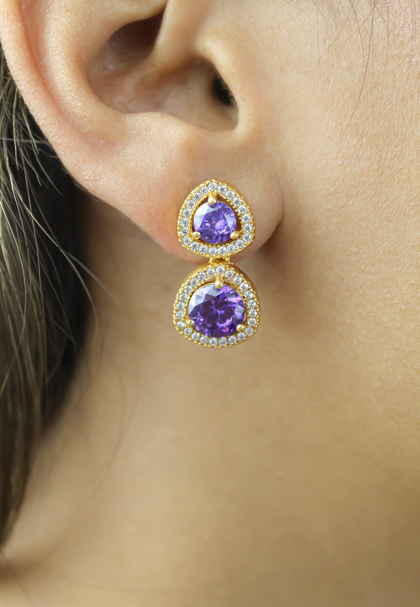 Elegant Nikobar Stone Earrings featuring gold plating and sparkling crystals, inspired by the Nikobar archipelago.