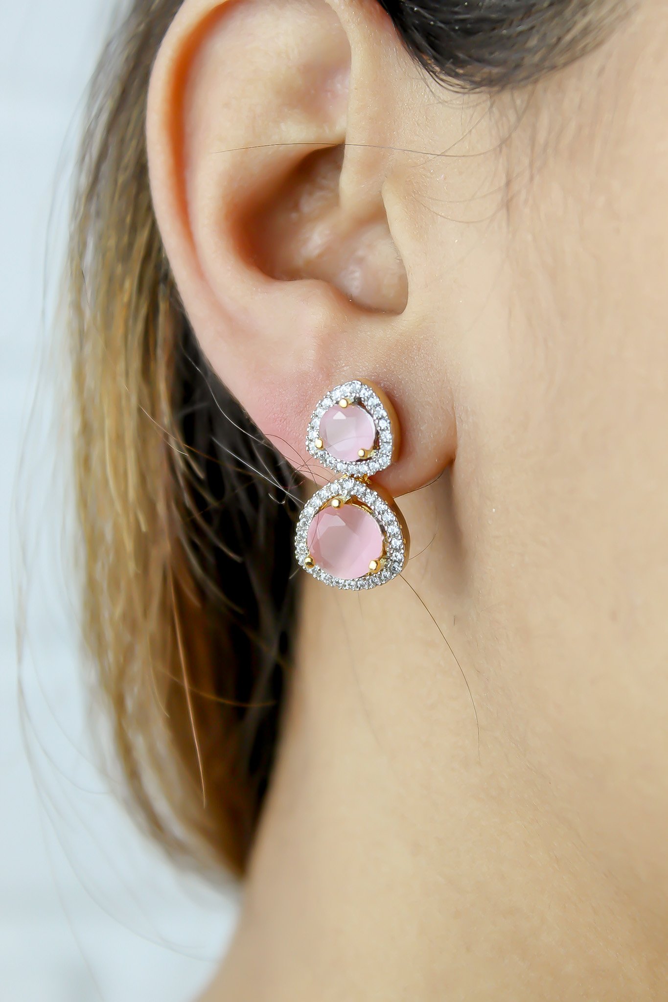 Elegant Nikobar Stone Earrings featuring gold plating and sparkling crystals, inspired by the Nikobar archipelago.