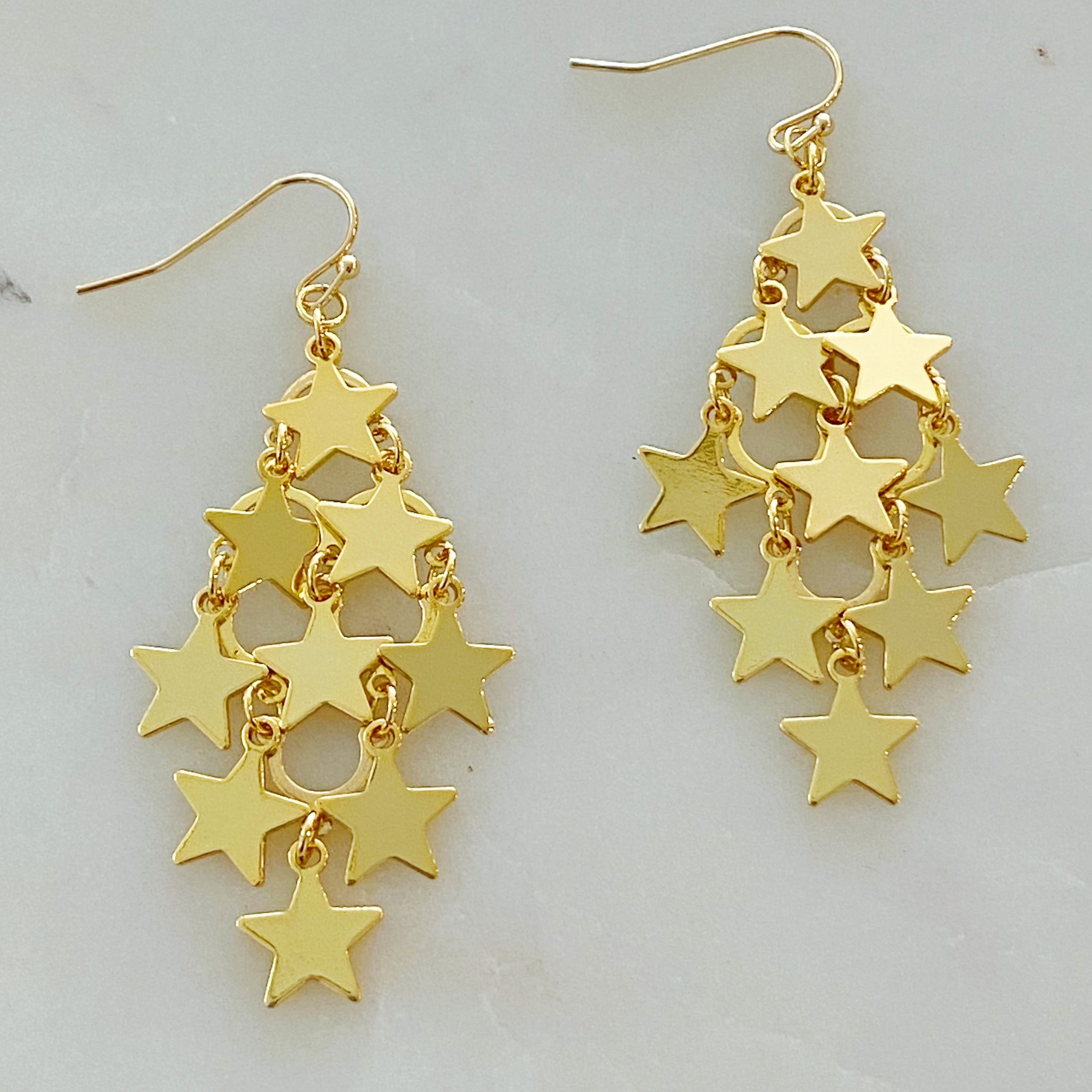 Nine Stars Lined Chandelier Earrings featuring golden stars and delicate draping, elegantly designed for a sophisticated look.