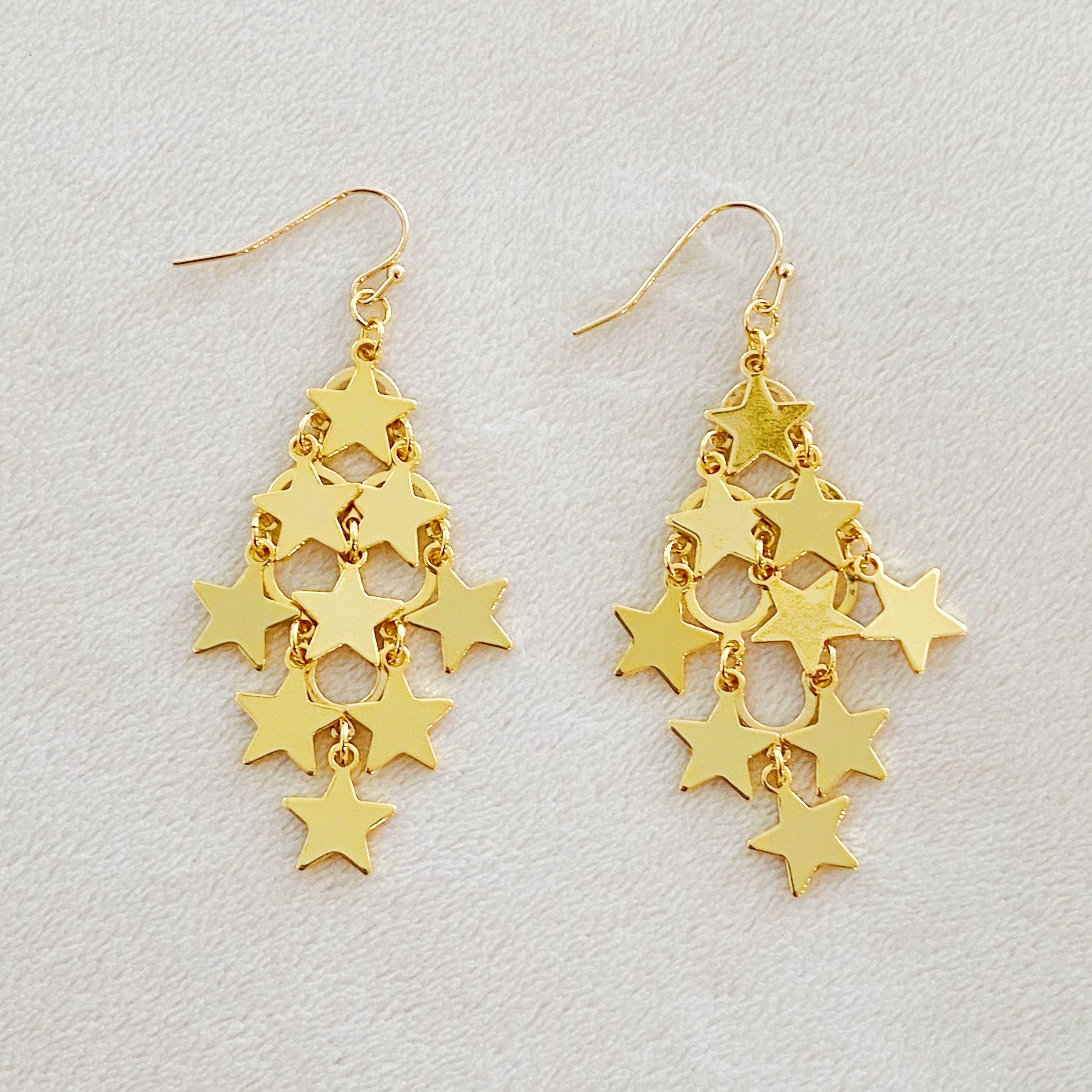 Nine Stars Lined Chandelier Earrings featuring golden stars and delicate draping, elegantly designed for a sophisticated look.