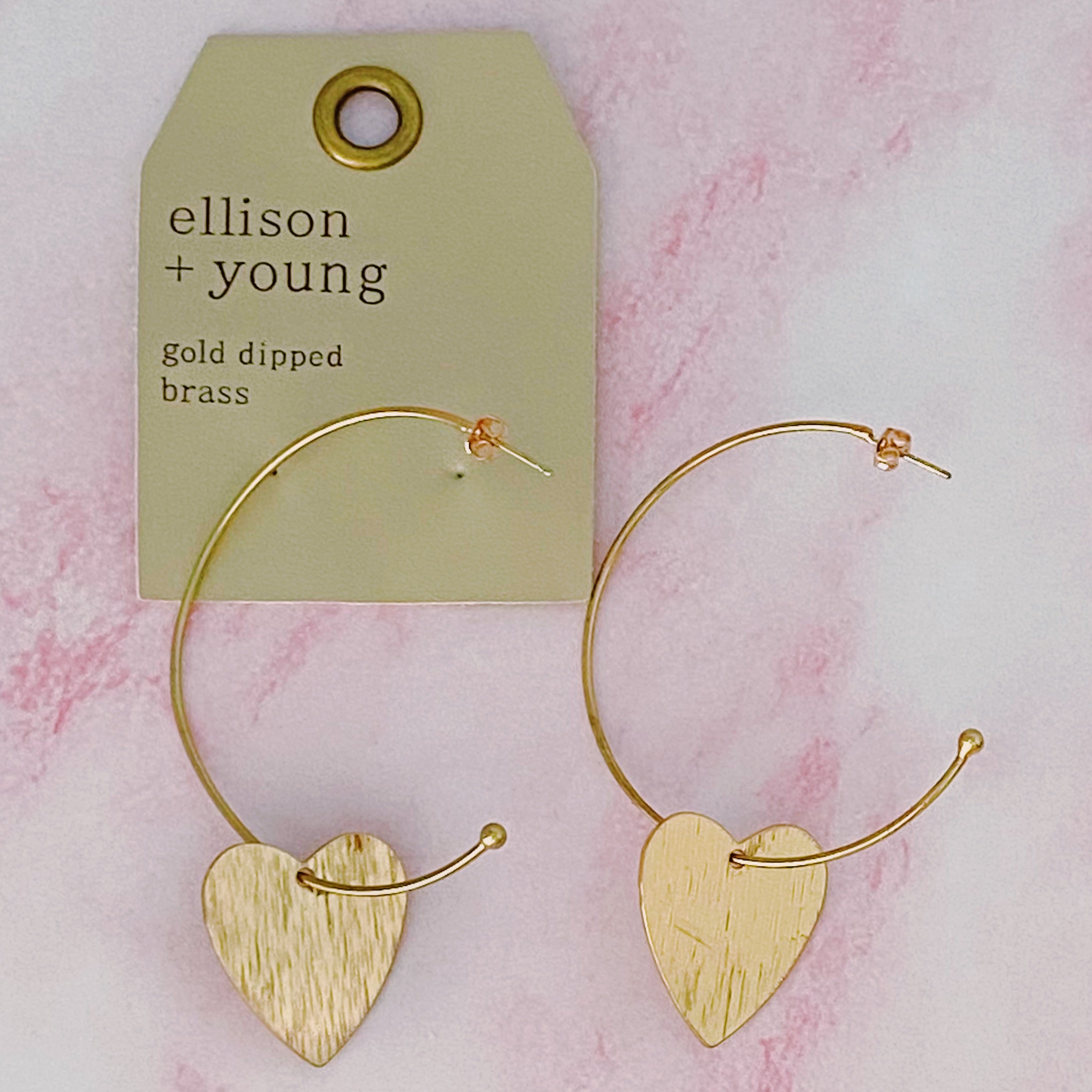 Stylish No Games Heart Hoop Earrings featuring a brushed texture heart pendant on a slim gold plated brass hoop.