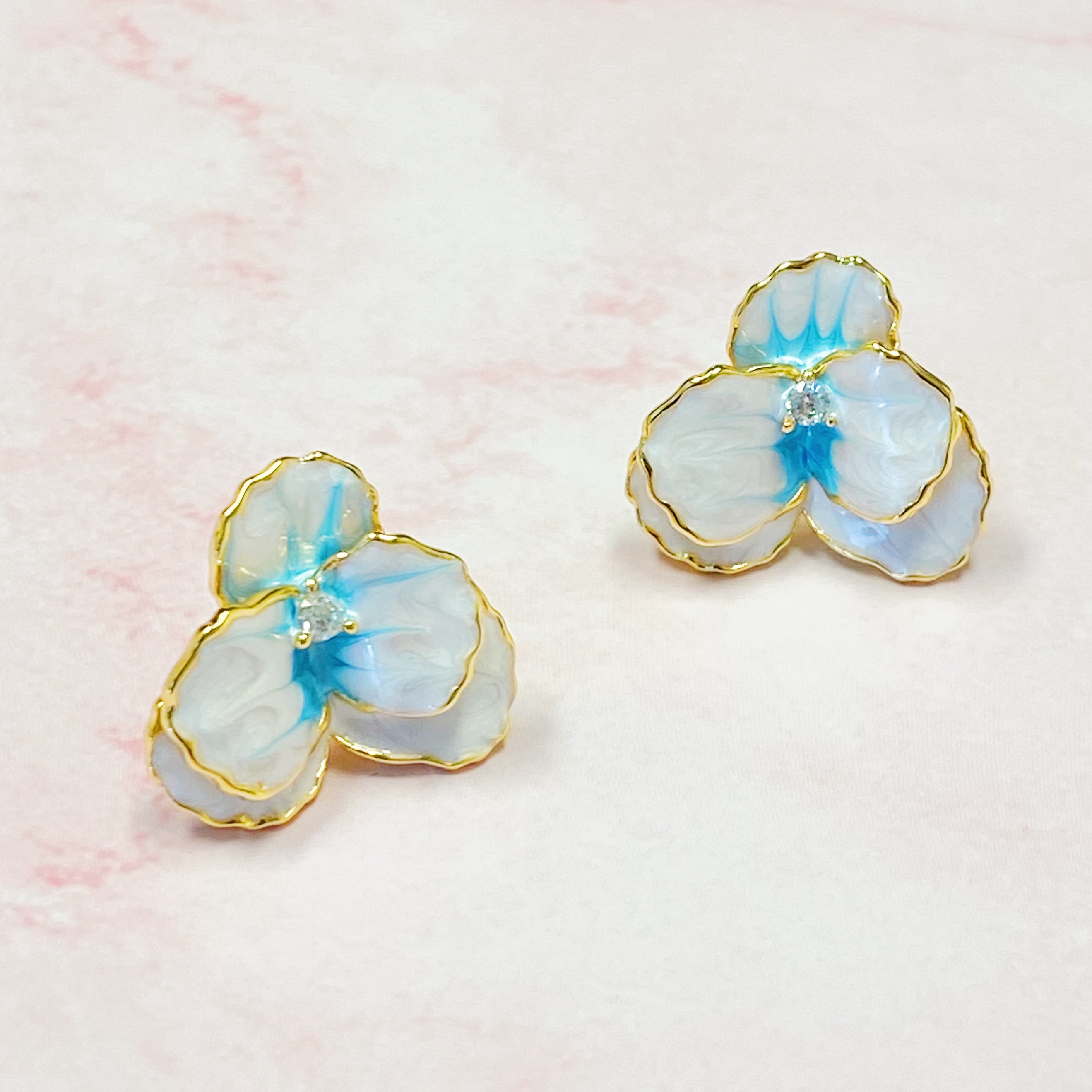 Noble Bloom Flower Earrings featuring white and blue enamel finish with 18K gold plated brass.