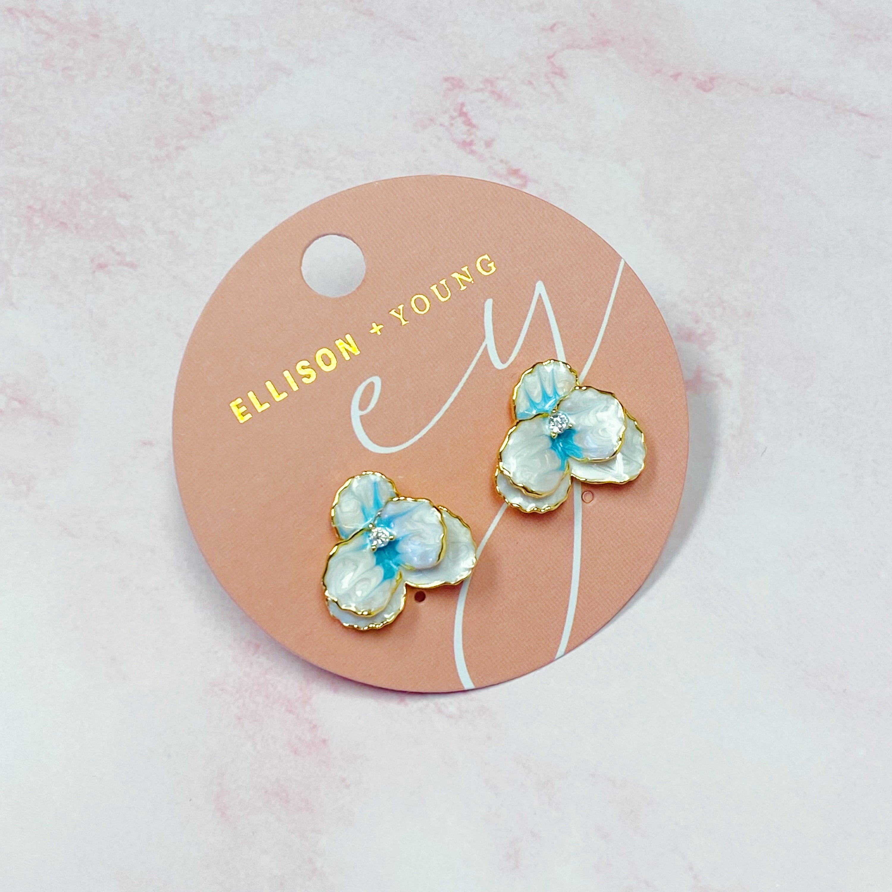 Noble Bloom Flower Earrings featuring white and blue enamel finish with 18K gold plated brass.