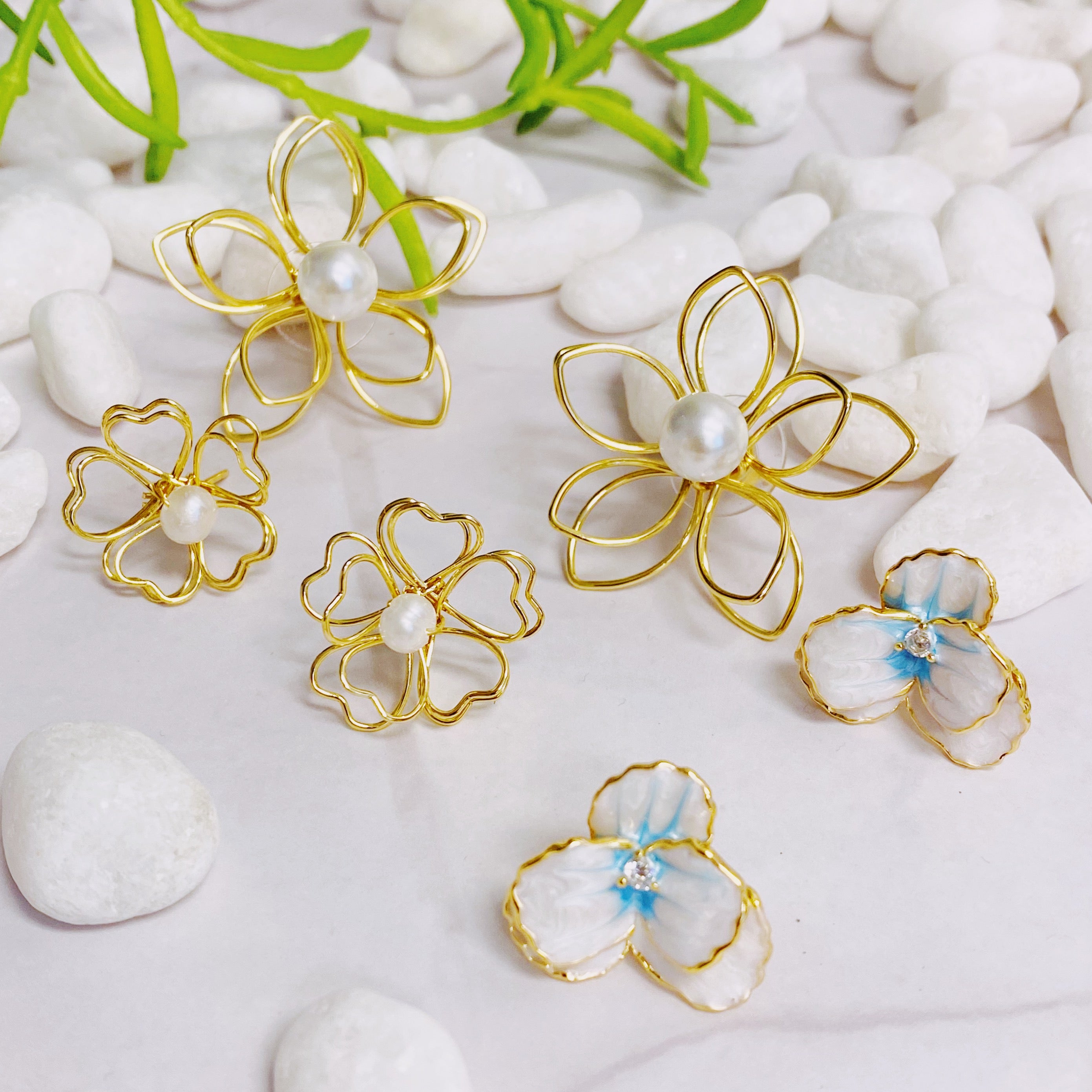 Noble Bloom Flower Earrings featuring white and blue enamel finish with 18K gold plated brass.