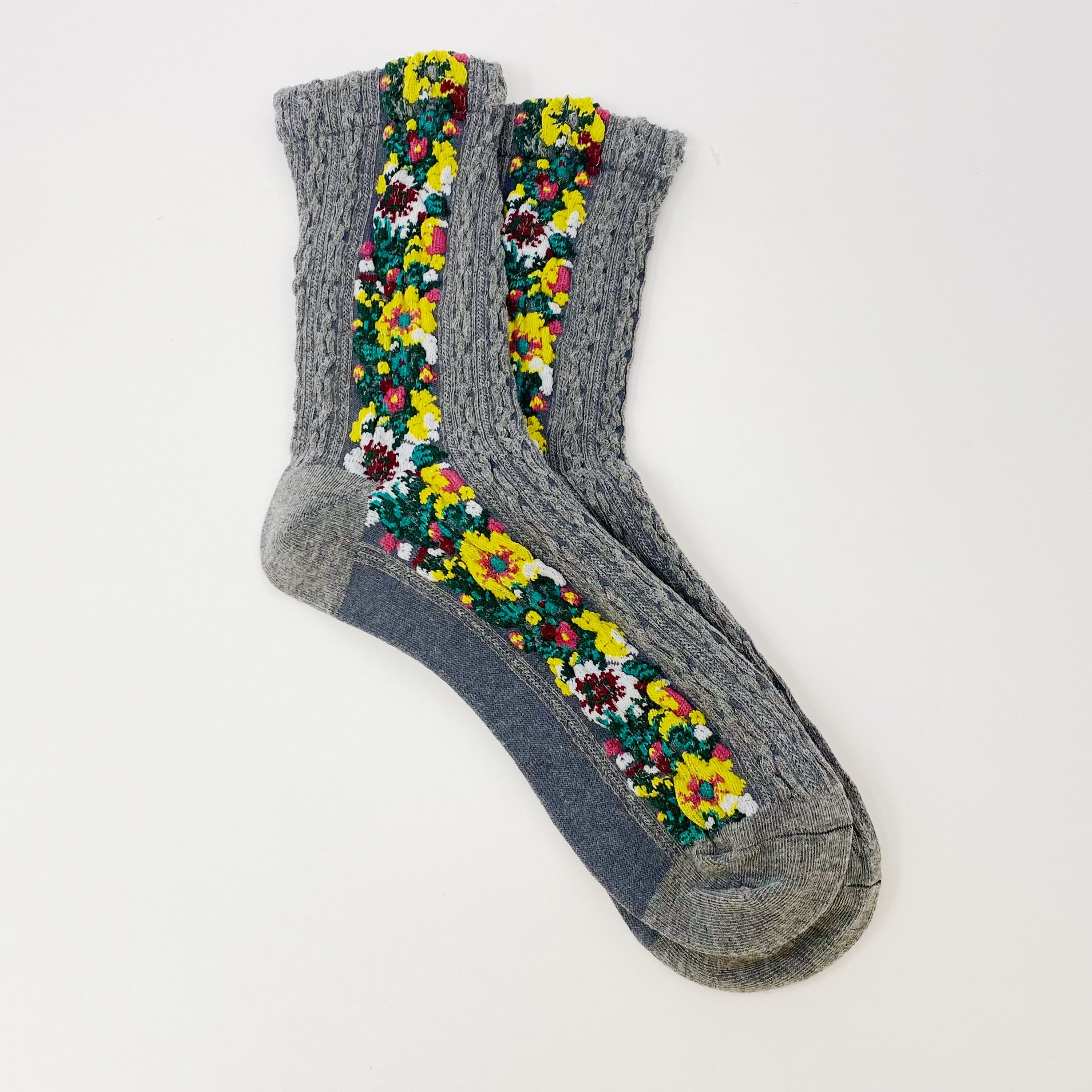 Noble Floral Beauty Socks featuring a vibrant knitted floral pattern, showcasing luxurious texture and elegant design.