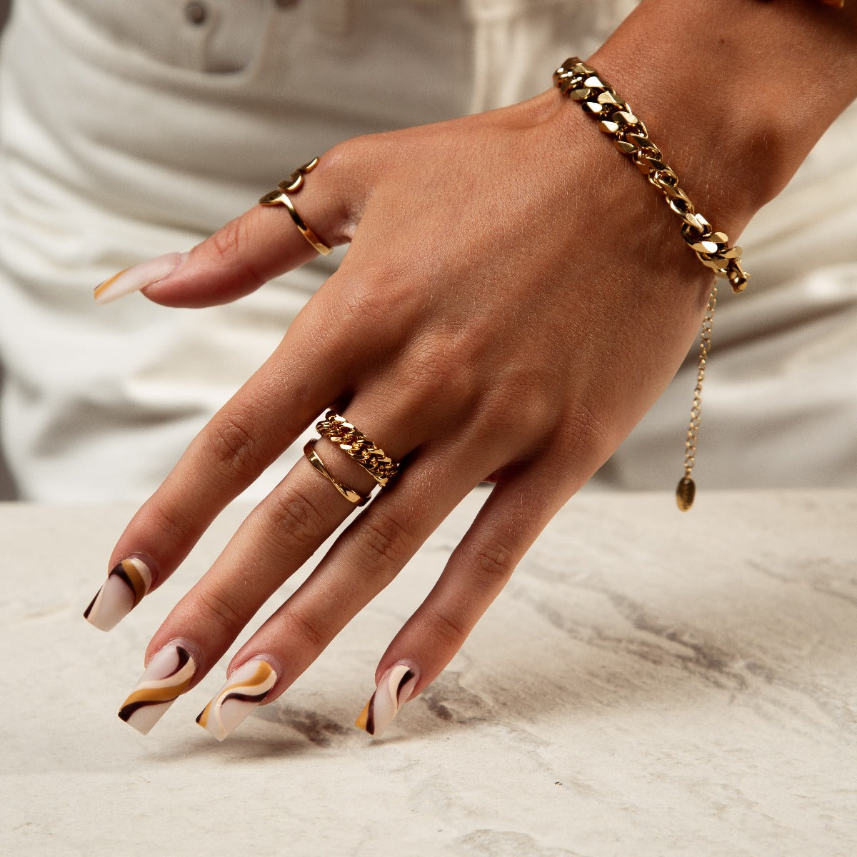 Noor Curb Link Chain Ring in Gold, showcasing its elegant design and premium stainless steel finish.