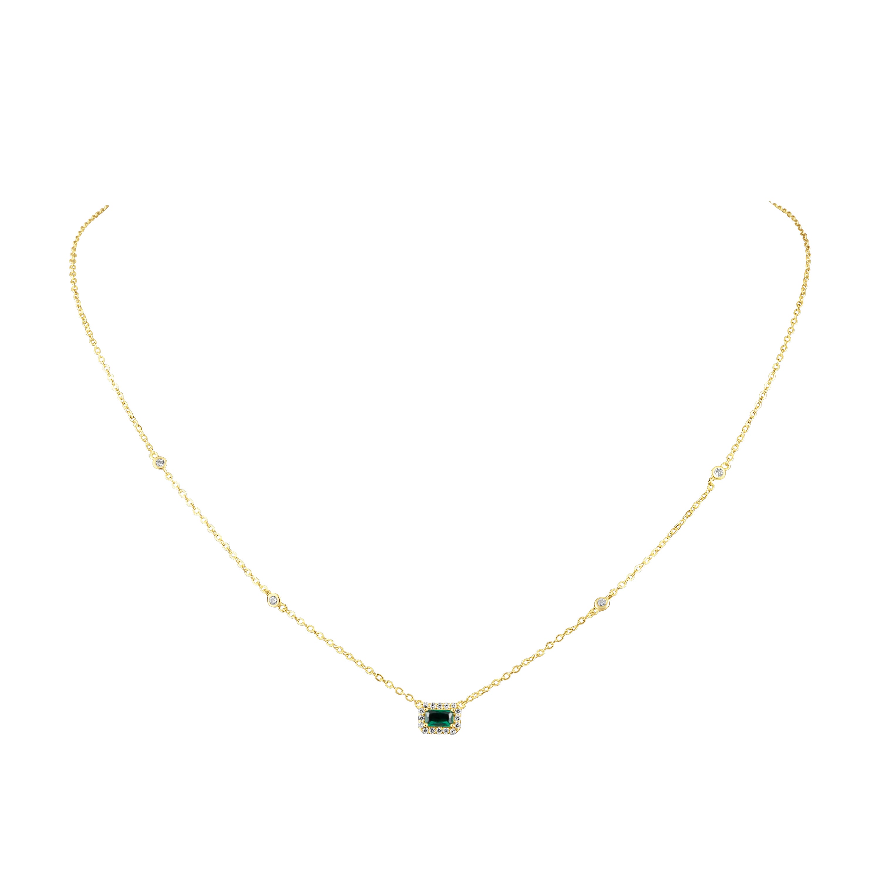 Nora Emerald Necklace featuring a gold chain and sparkling Emerald CZ stones, perfect for elegant styling.