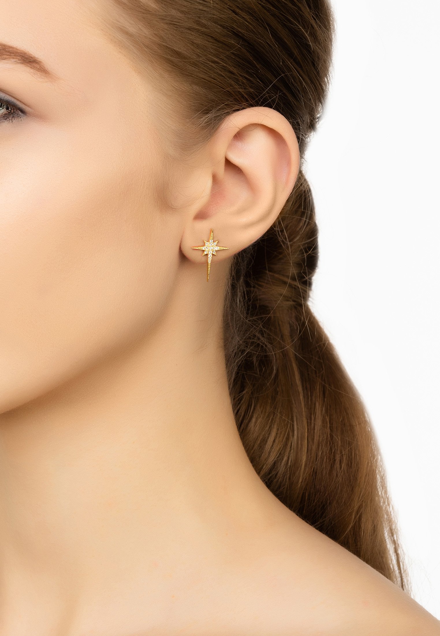 North Star Small Stud Earrings in Gold with sparkling zirconia, elegantly designed in a star shape.