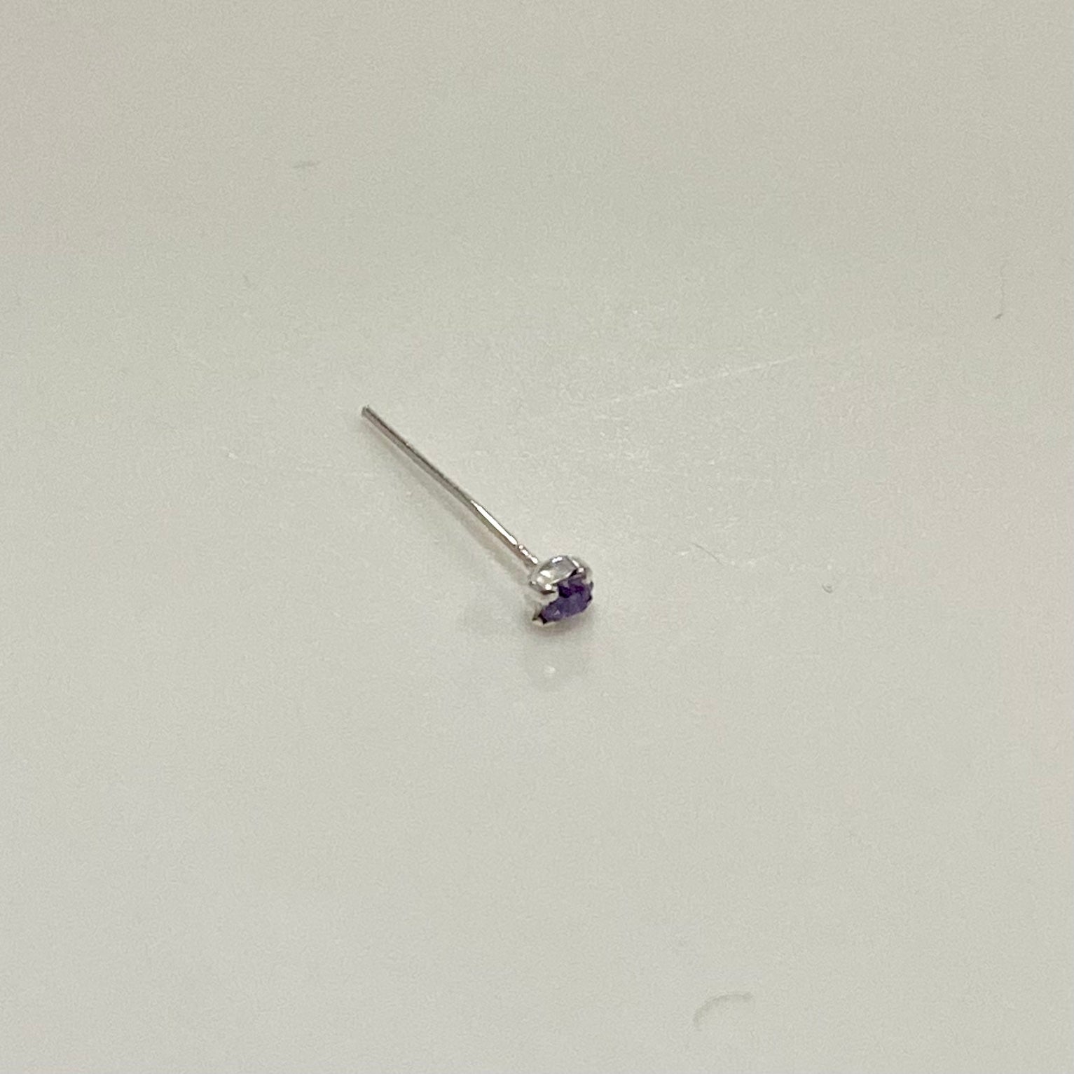 A beautiful Nose Pin with Gemstone in various colors, crafted from surgical steel, showcasing its adjustable design and elegant appearance.