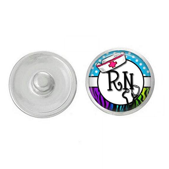 Nurse RN Snap jewelry piece featuring hand-pressed decorative snaps for charm bracelets and accessories.