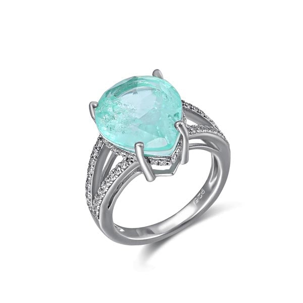 Ocean blue paraiba romance ring featuring a heart-shaped blue paraiba stone and white sapphire accents, set in sterling silver with white gold finish.