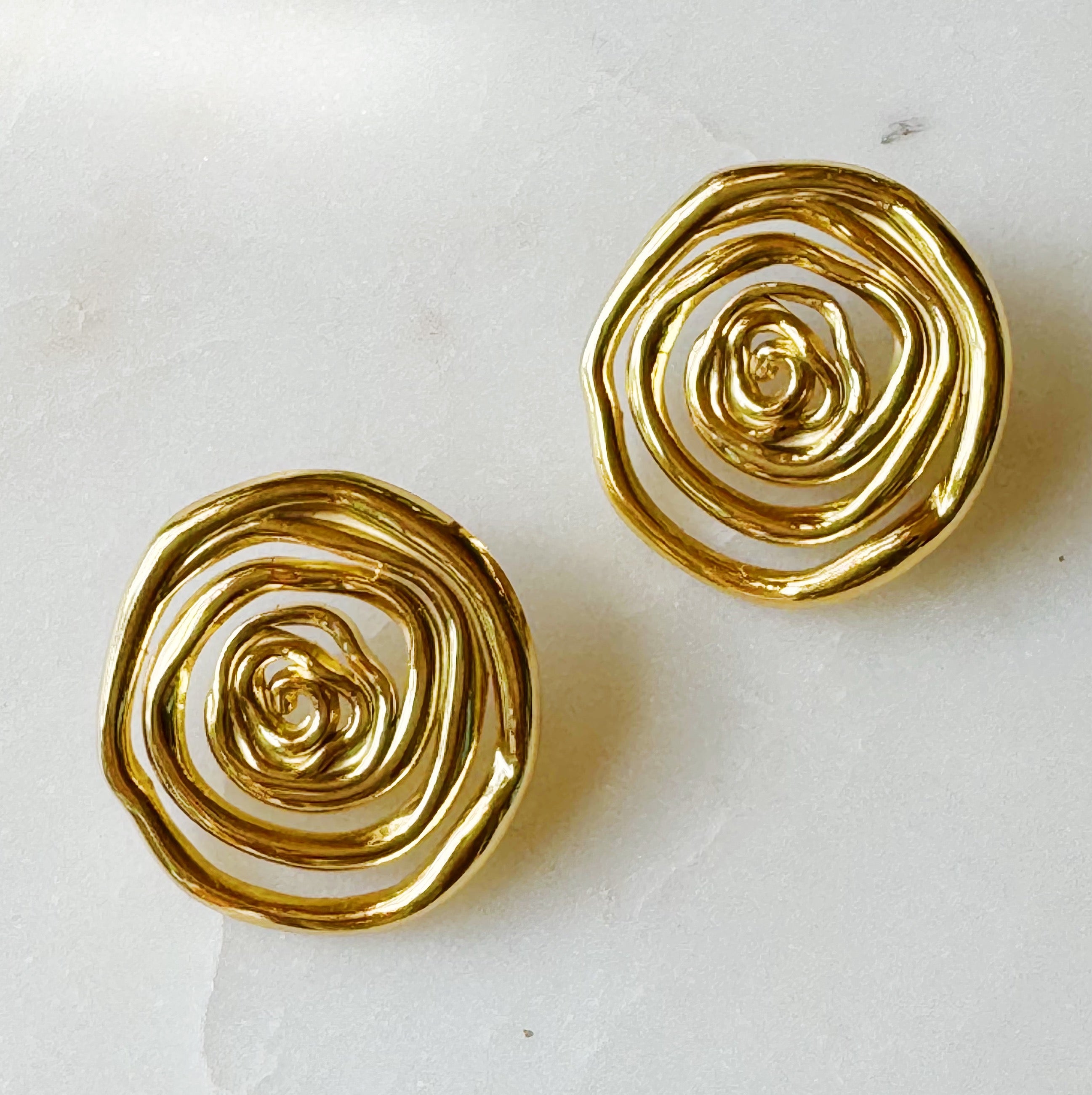 Elegant Oh My Gold Swirl Stud Earrings featuring a unique swirl design in 18k gold plating, perfect for any outfit.