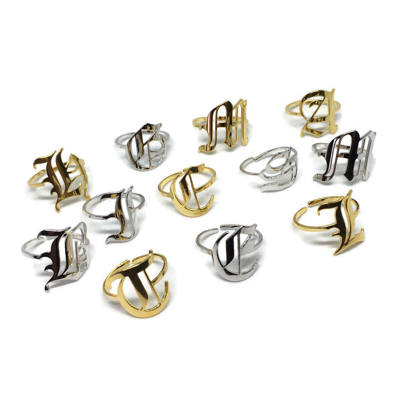 Old English Adjustable Initial Ring in stainless steel, showcasing customizable letter options and various colors.