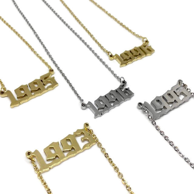 Old English Birth Year Necklace in stainless steel with customizable year and color options, featuring a 45cm chain and a 2.5 x 1cm pendant.