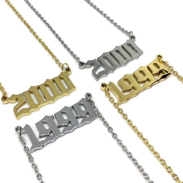 Old English Birth Year Necklace in stainless steel with customizable year and color options, featuring a 45cm chain and a 2.5 x 1cm pendant.