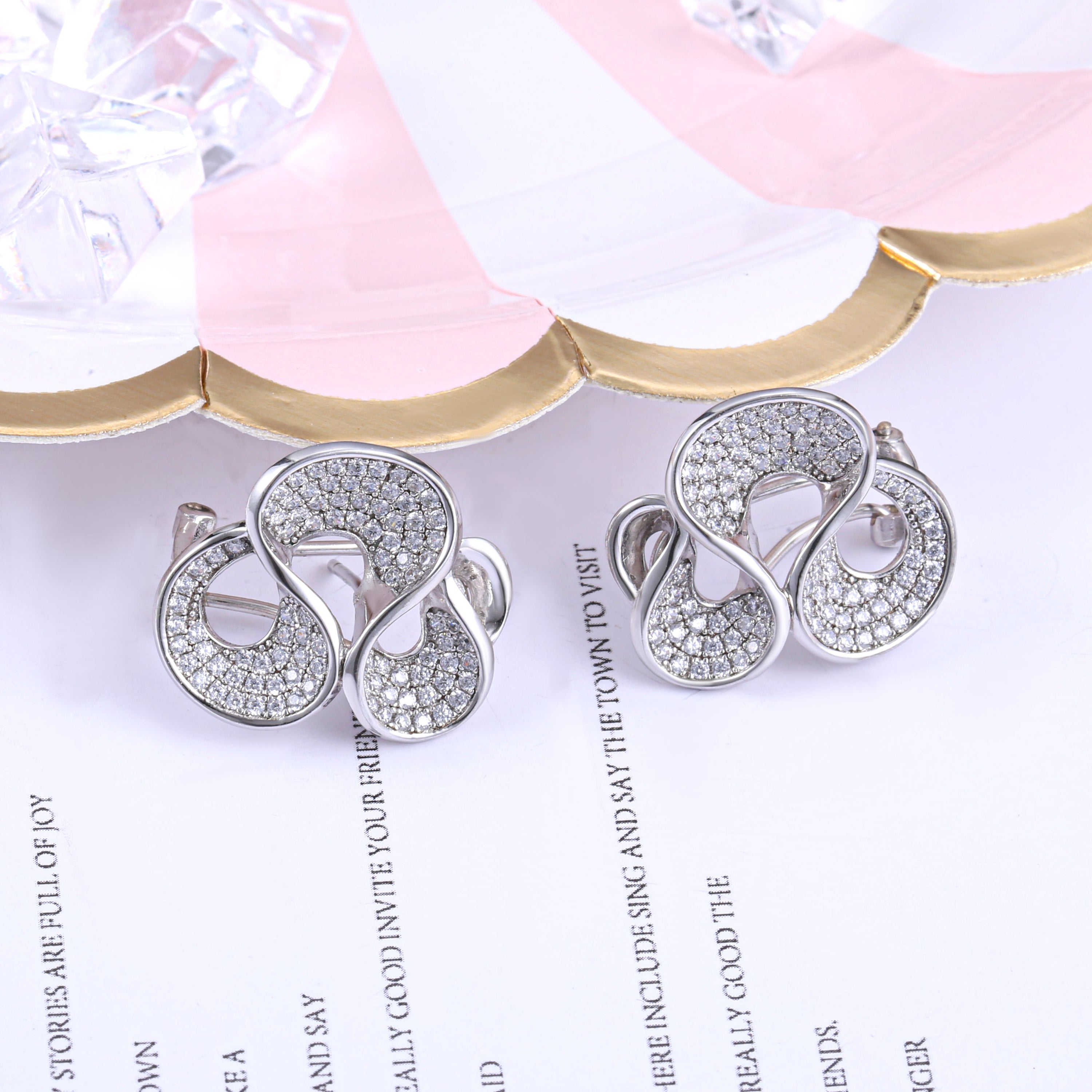 Elegant Omega Spray Earrings made of 925 sterling silver with white sapphire, showcasing a luxurious design.