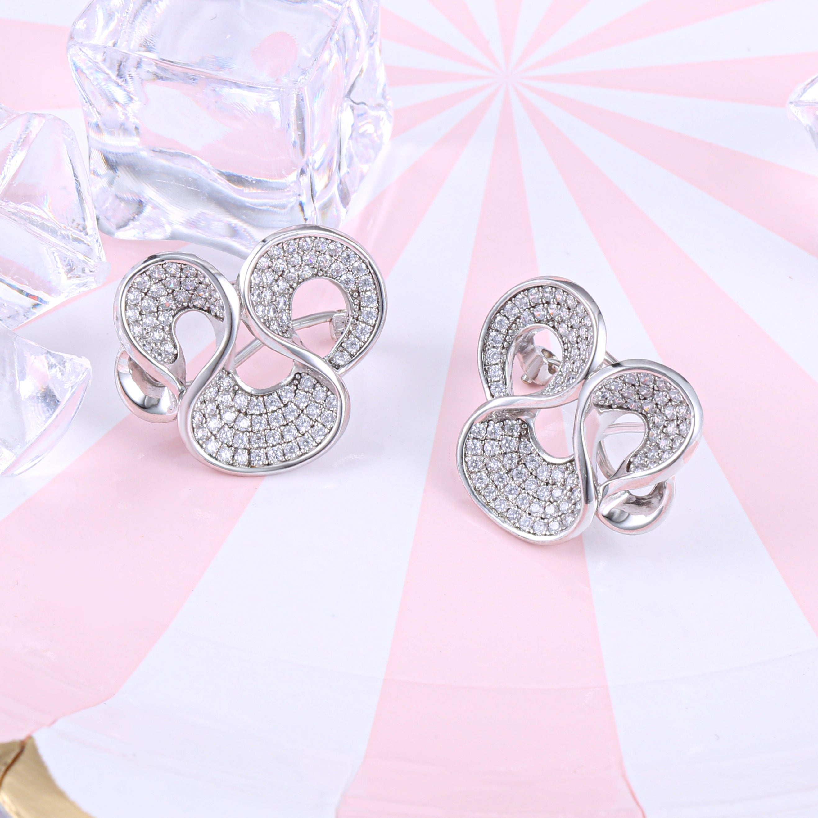 Elegant Omega Spray Earrings made of 925 sterling silver with white sapphire, showcasing a luxurious design.